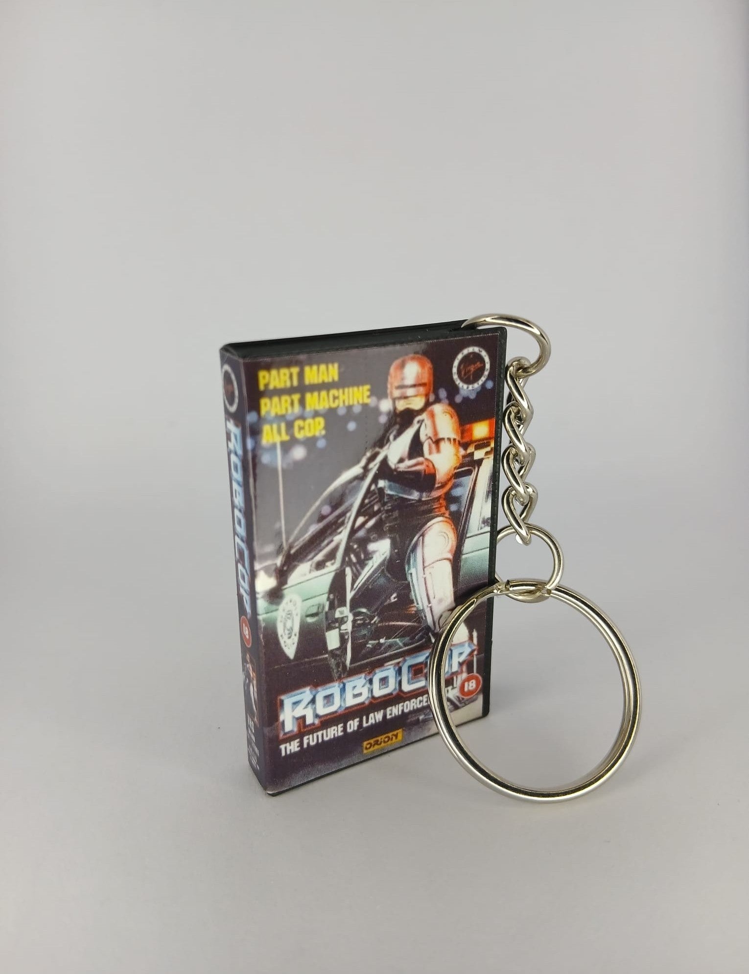 RoboCop Mini VHS Keyring – flat lay