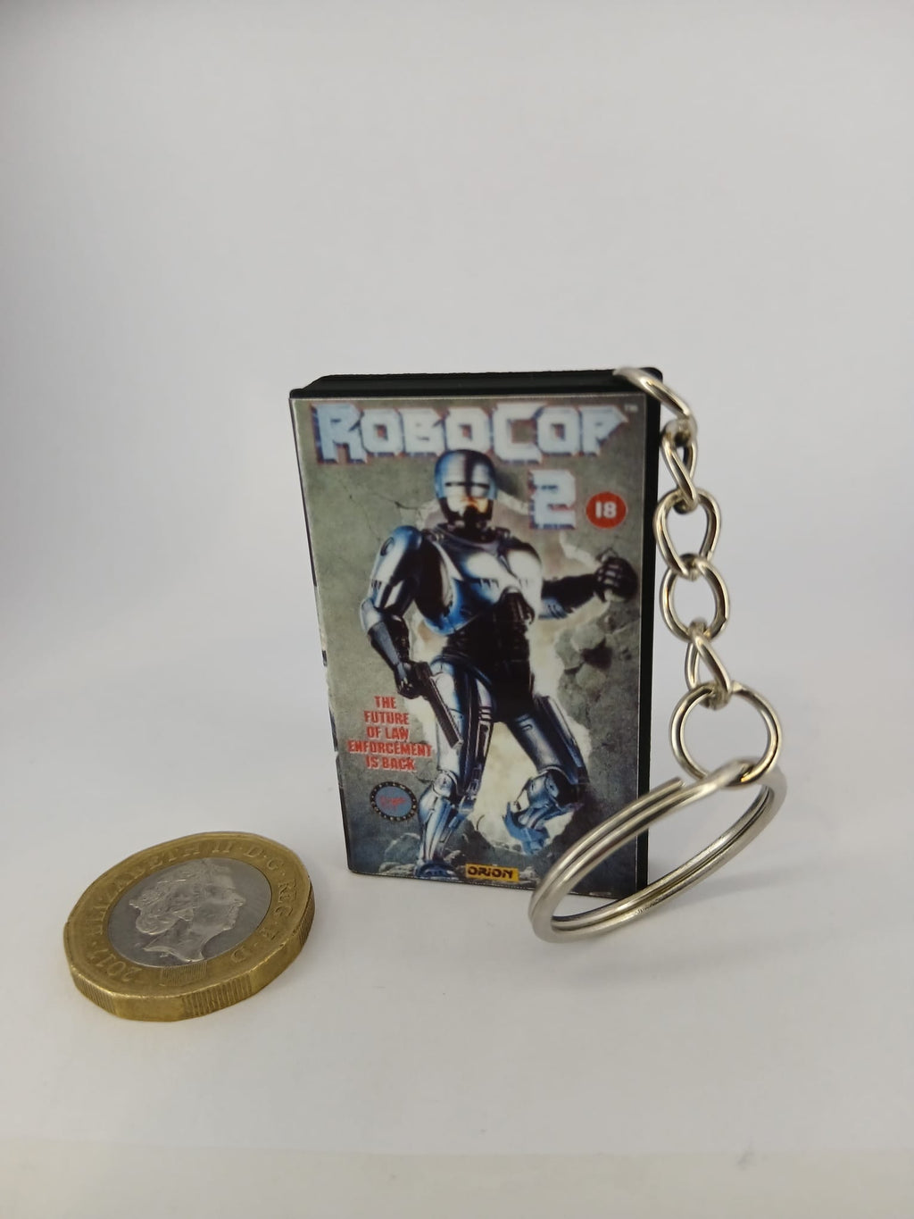 RoboCop 2 VHS keyring — back cover angled view standing