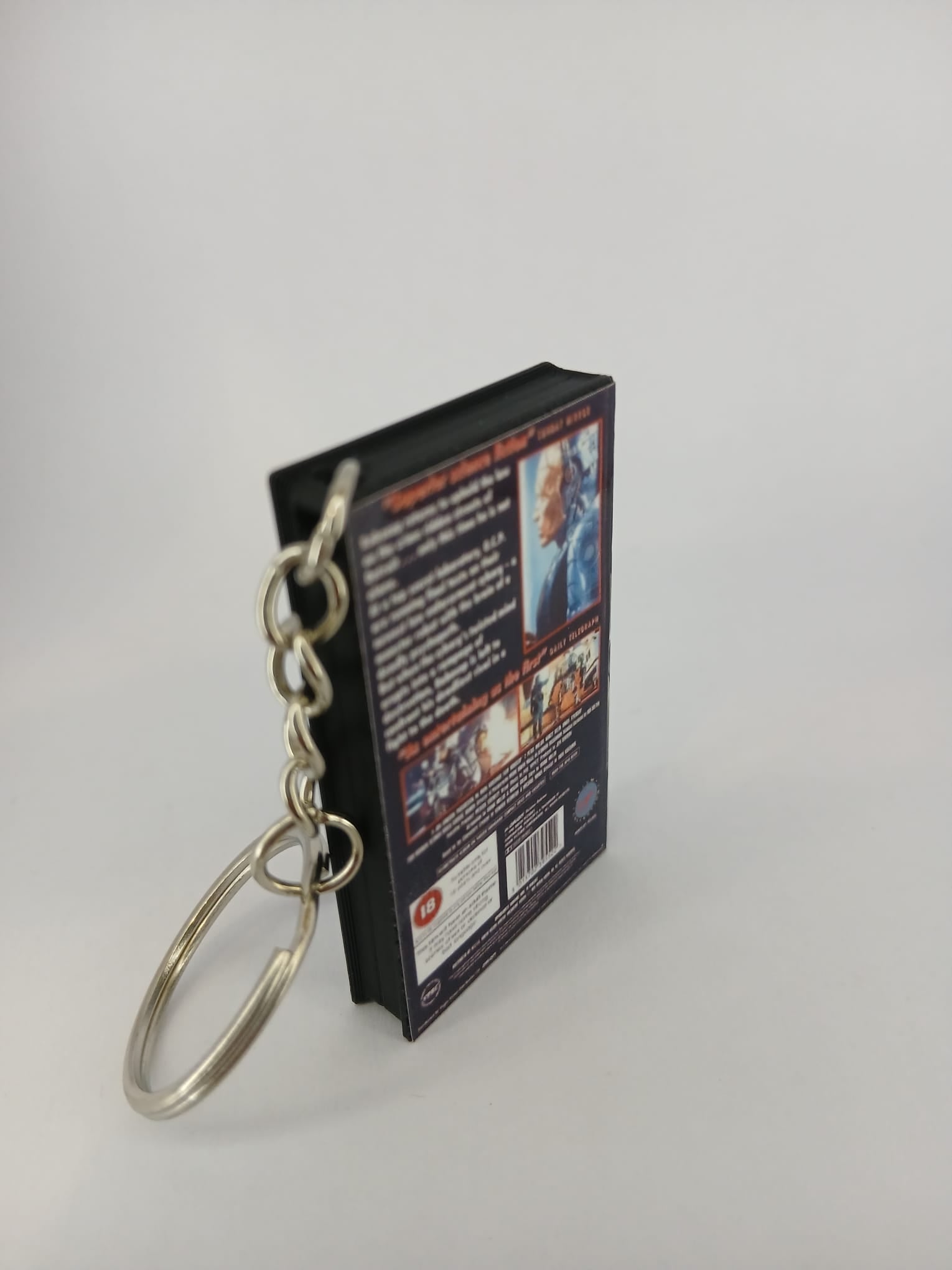 RoboCop 2 VHS keyring — back cover standing angled 2