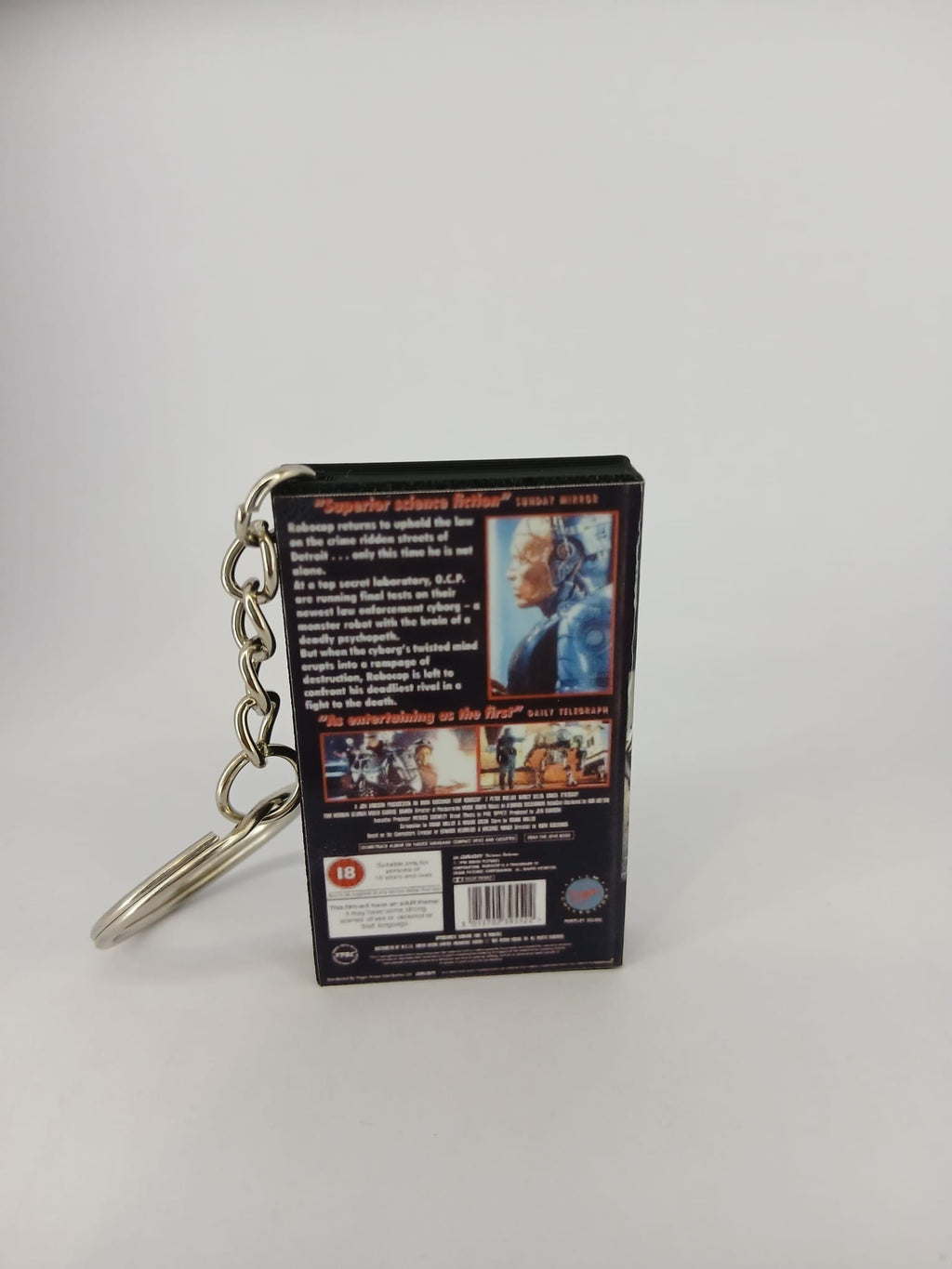RoboCop 2 VHS keyring — back and spine angled view standing