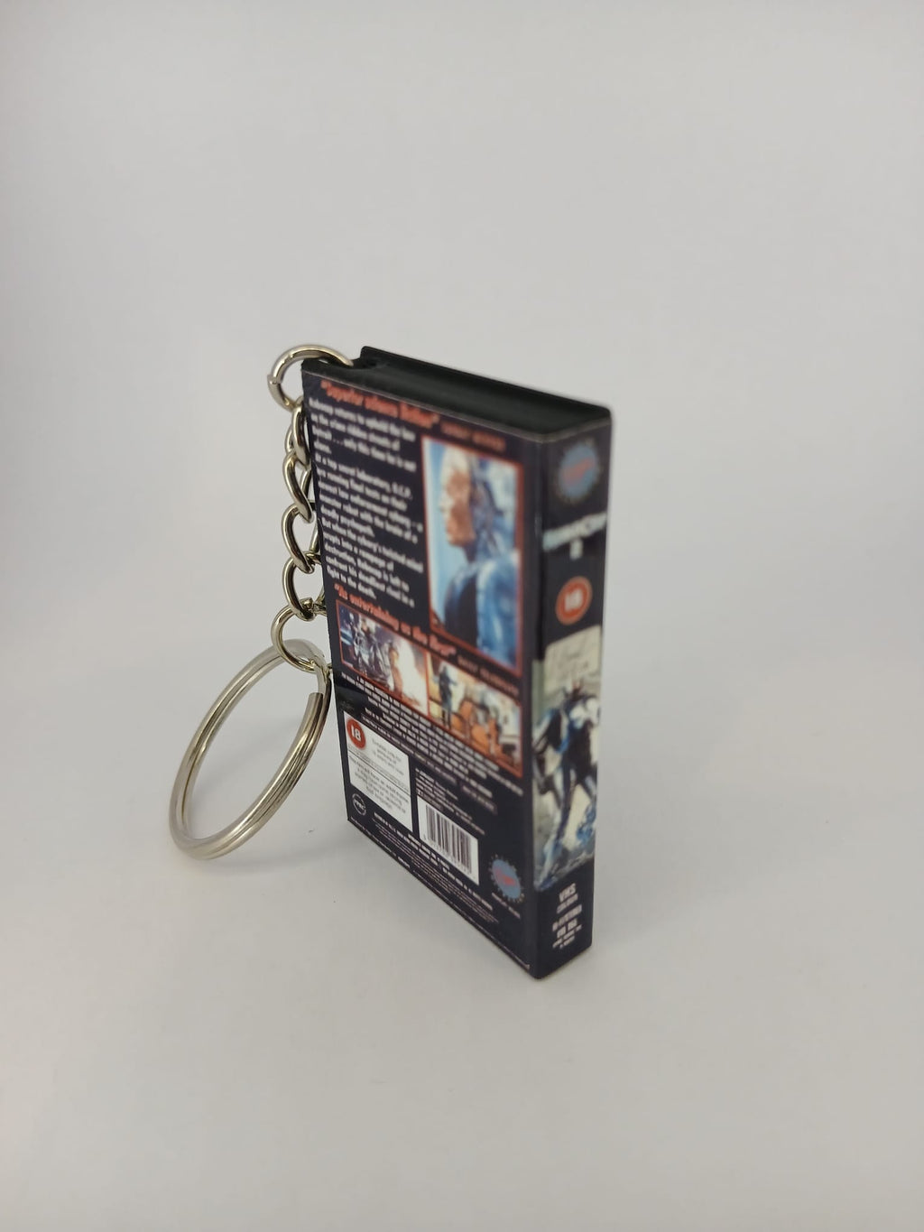 RoboCop 2 VHS keyring — spine view standing