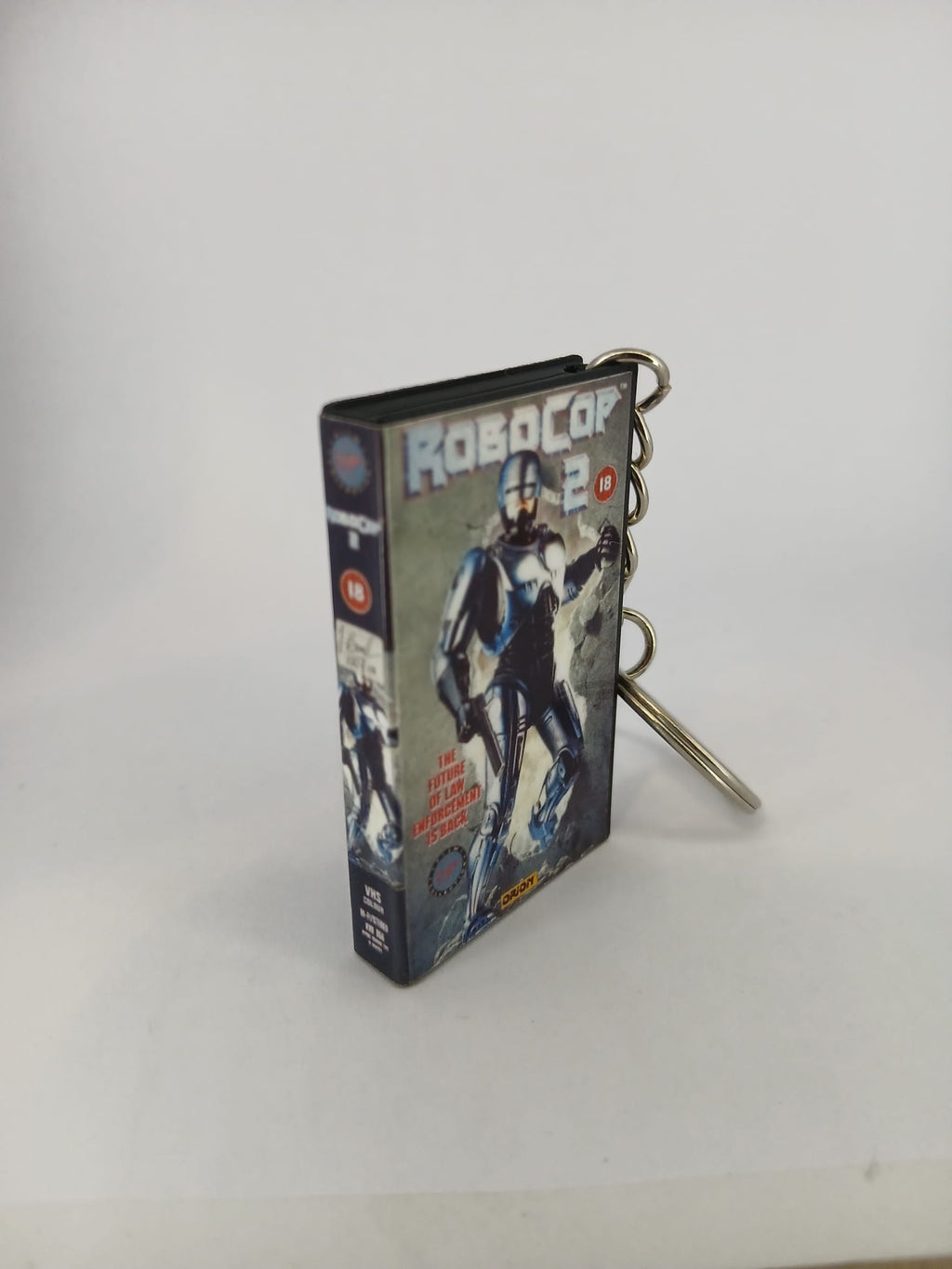 RoboCop 2 VHS keyring — front cover standing angled 2