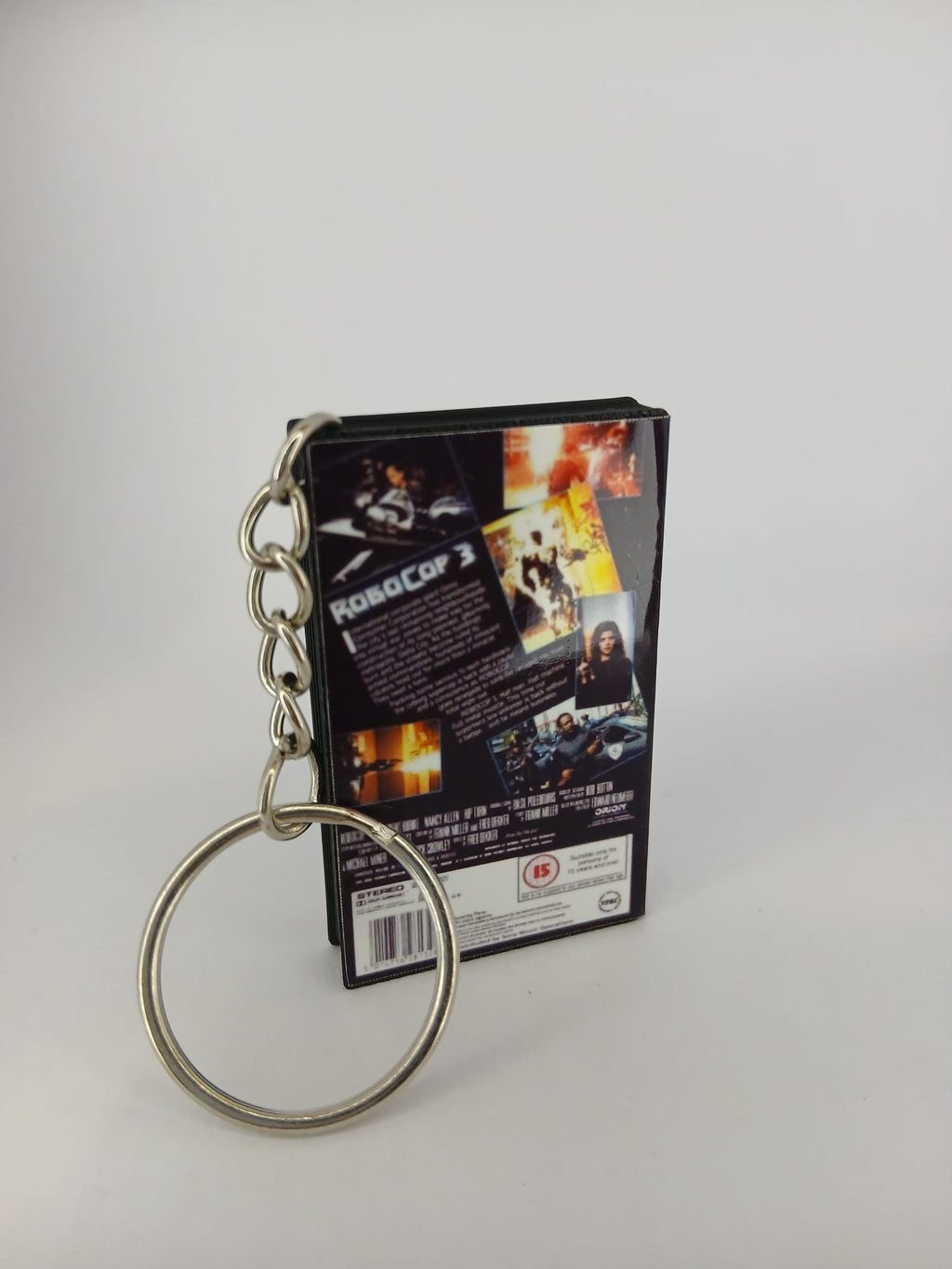 RoboCop 3 VHS keyring — back and spine angled view standing