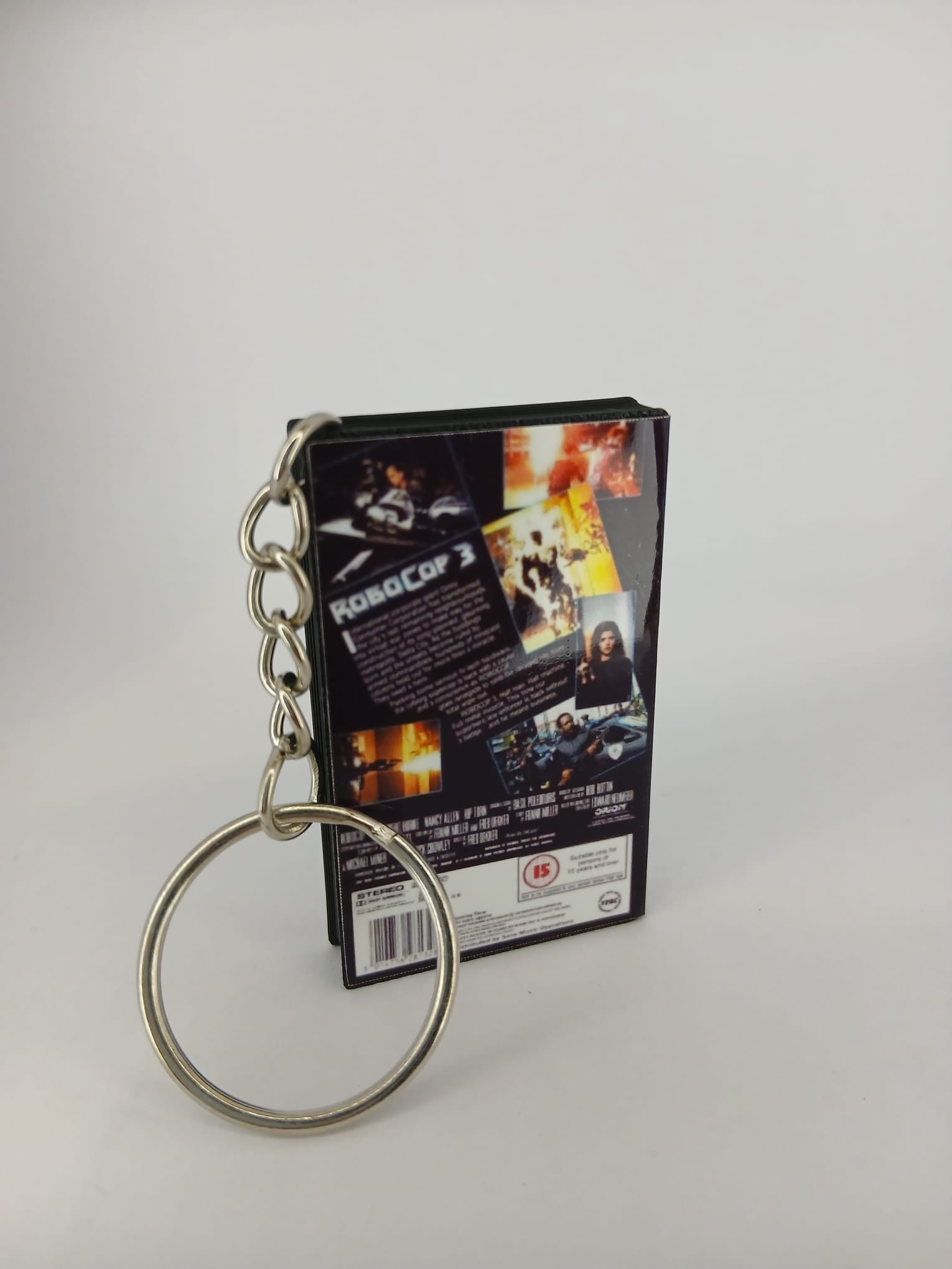 RoboCop 3 VHS keyring — back and spine angled view standing