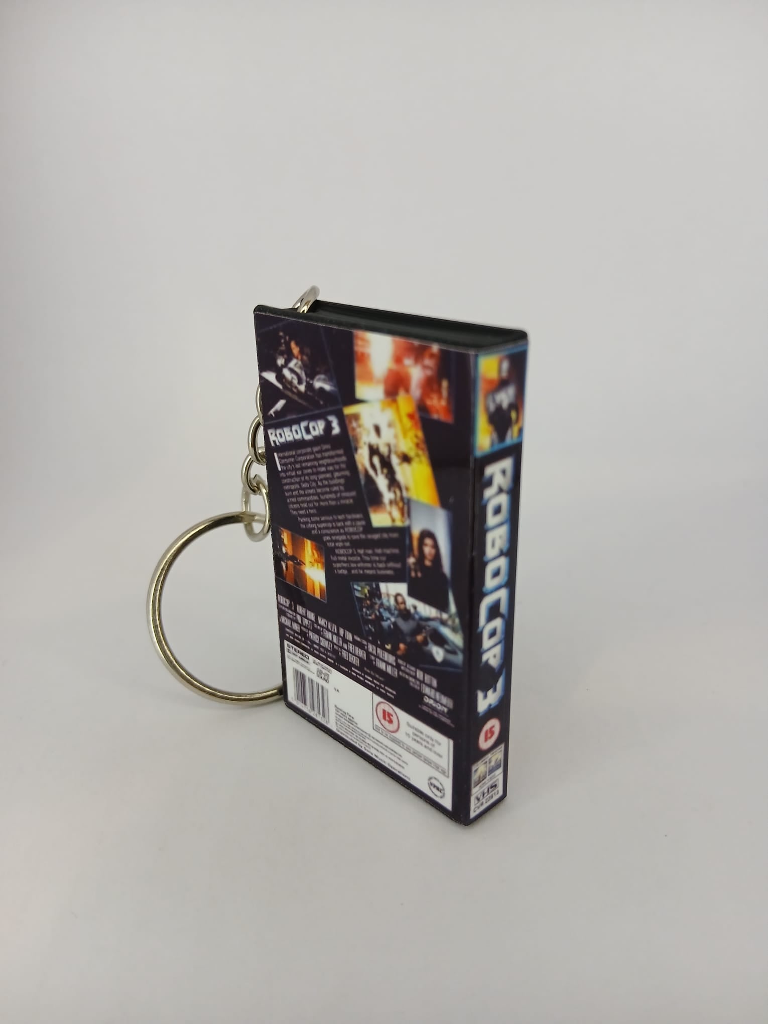 RoboCop 3 VHS keyring — spine view standing