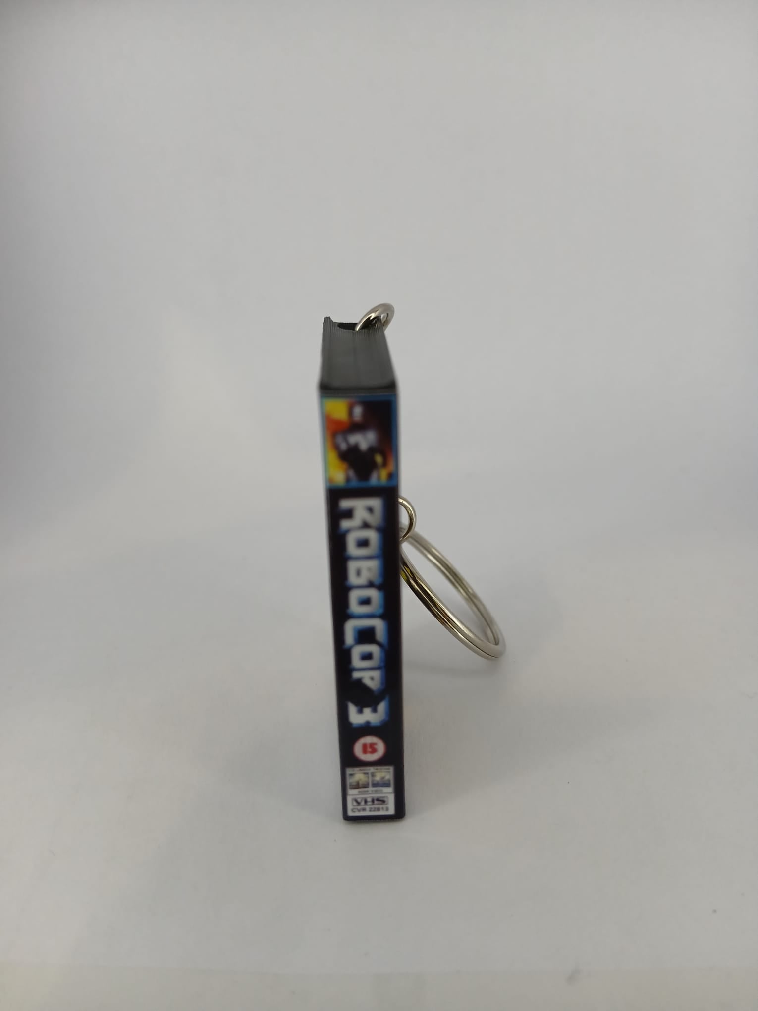 RoboCop 3 VHS keyring — front cover flat lay angled