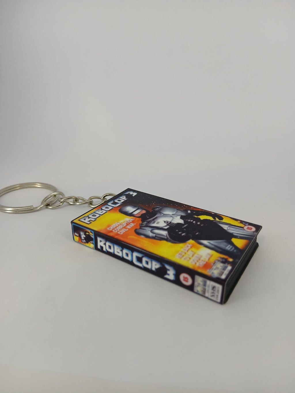 RoboCop 3 VHS keyring — front and spine angled view standing