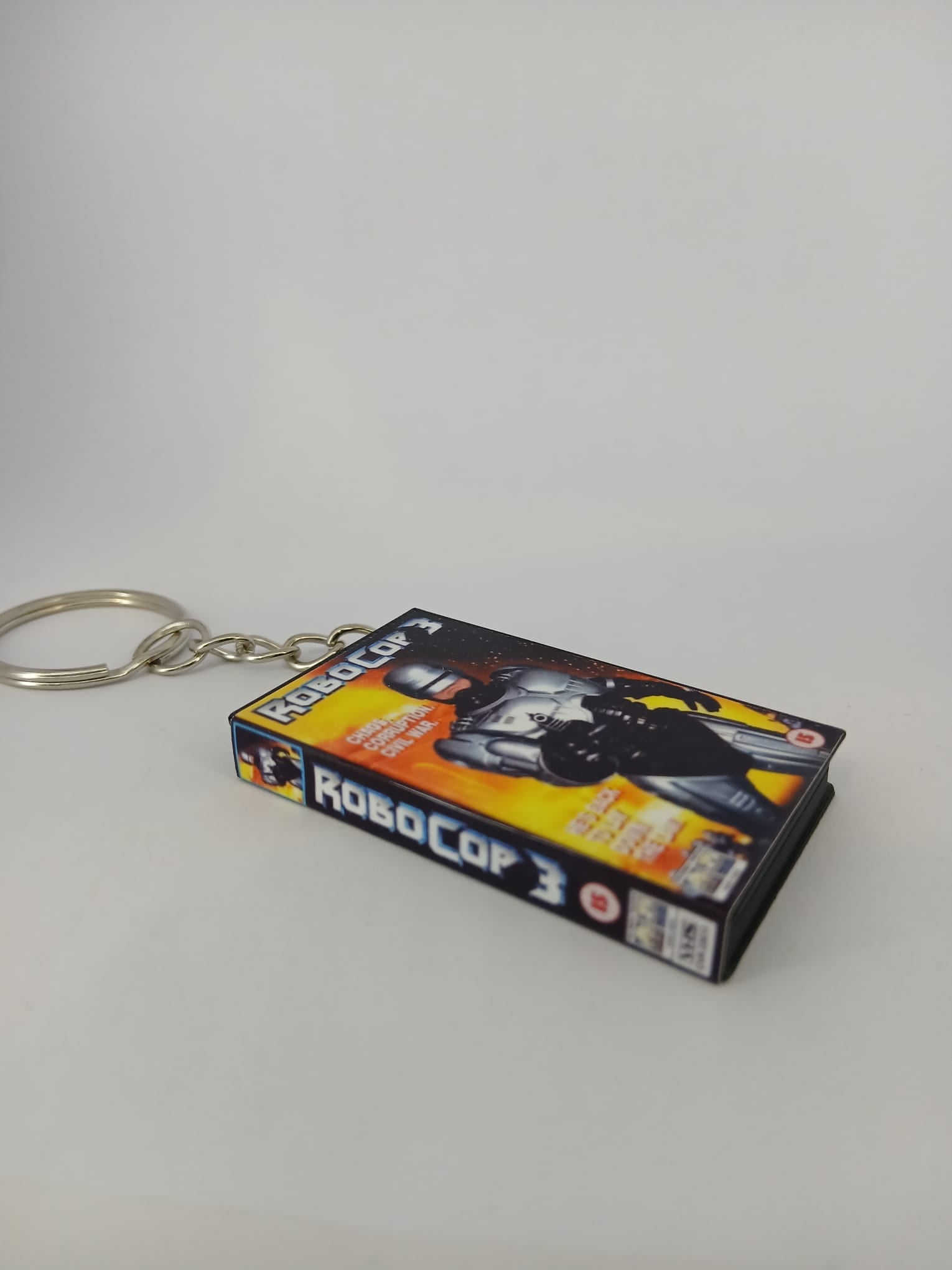RoboCop 3 VHS keyring — front and spine angled view standing