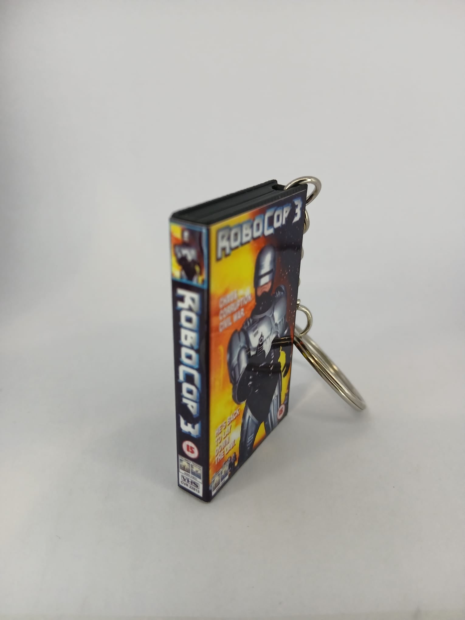 RoboCop 3 VHS keyring — front cover standing angled