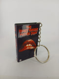 The Rocky Horror Picture Show VHS keyring — back cover angled view standing