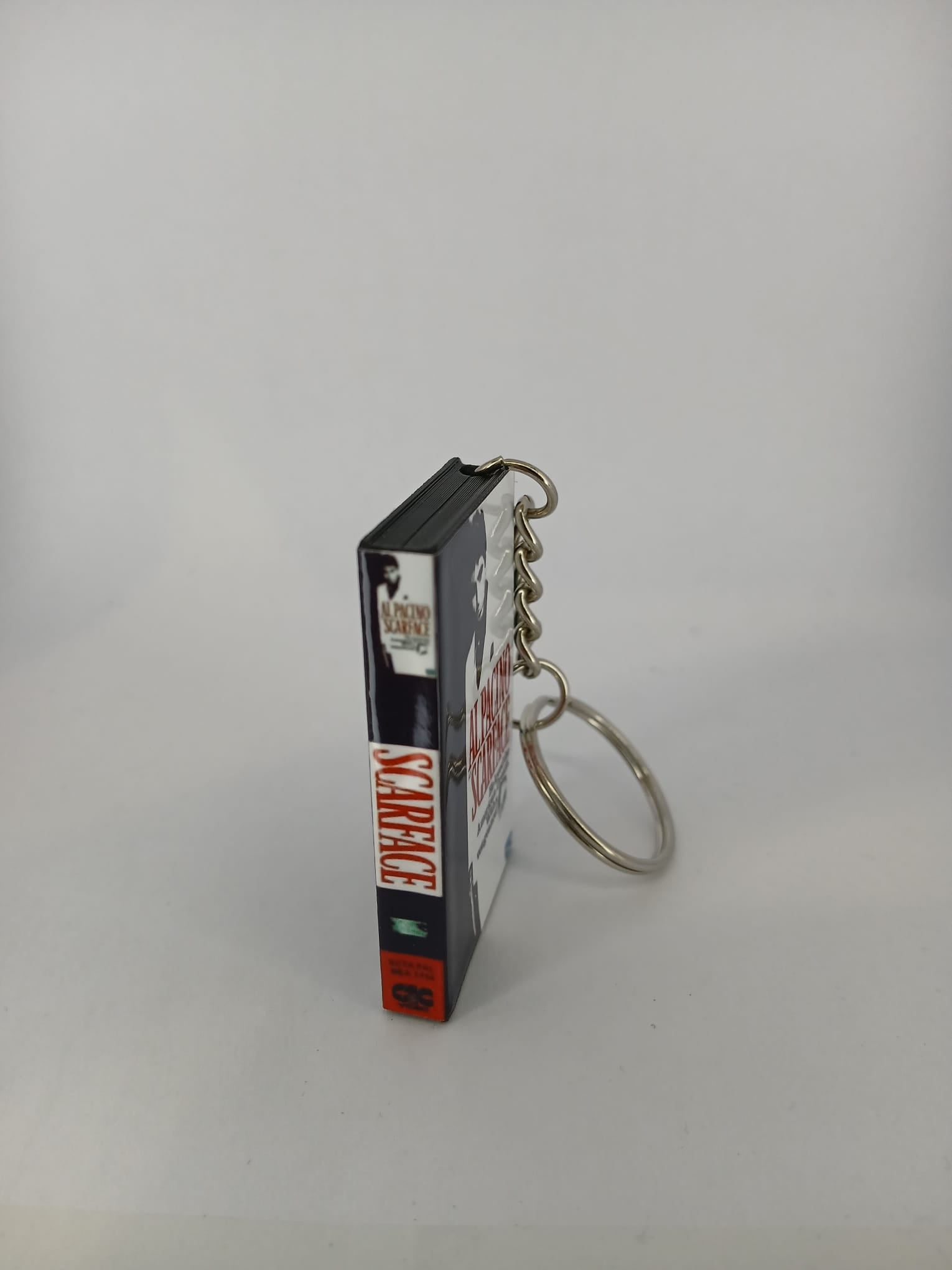 Scarface VHS keyring — flat lay front and spine angled