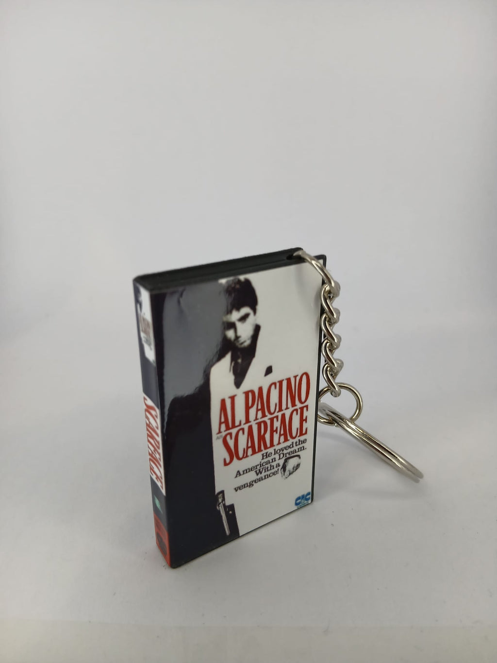 Scarface VHS keyring — back and spine angled view standing