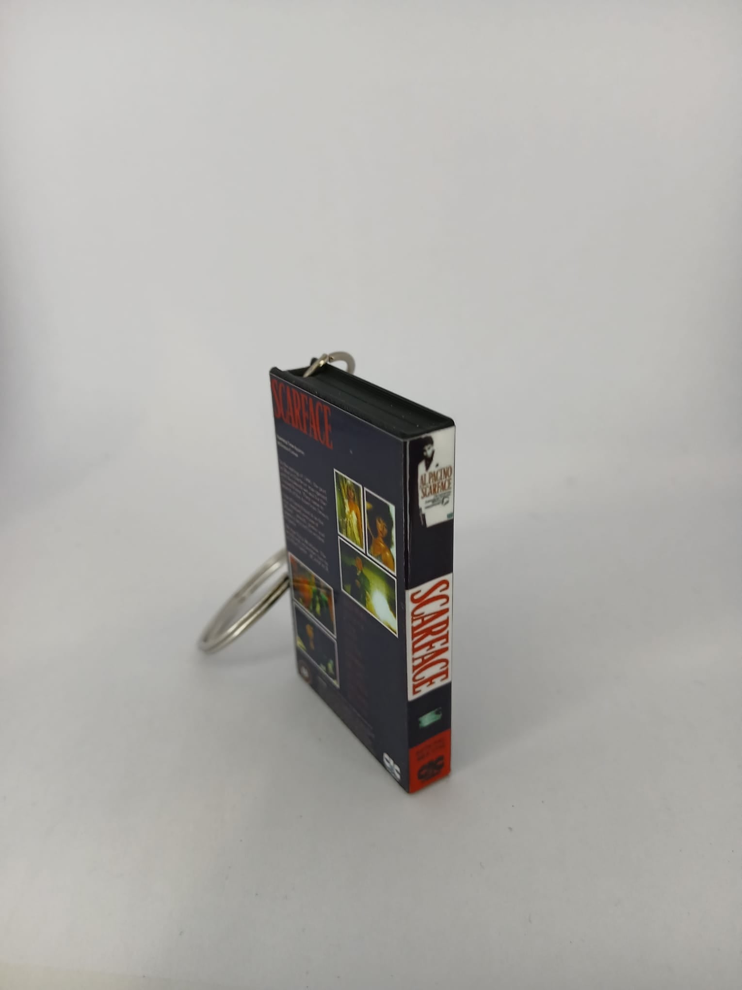 Scarface VHS keyring — spine view standing