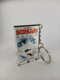 Scream VHS keyring — back cover angled view standing