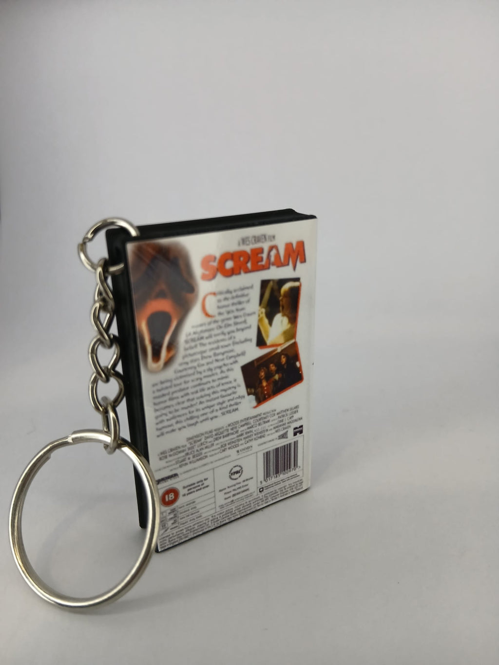 Scream VHS keyring — spine view standing