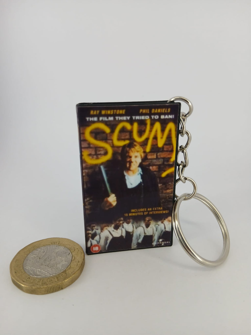 Scum VHS keyring — front cover standing angled 2