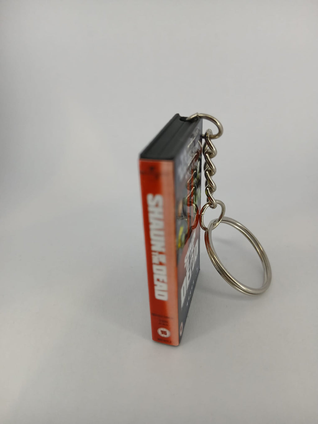 Shaun of the Dead VHS keyring — back cover angled view standing
