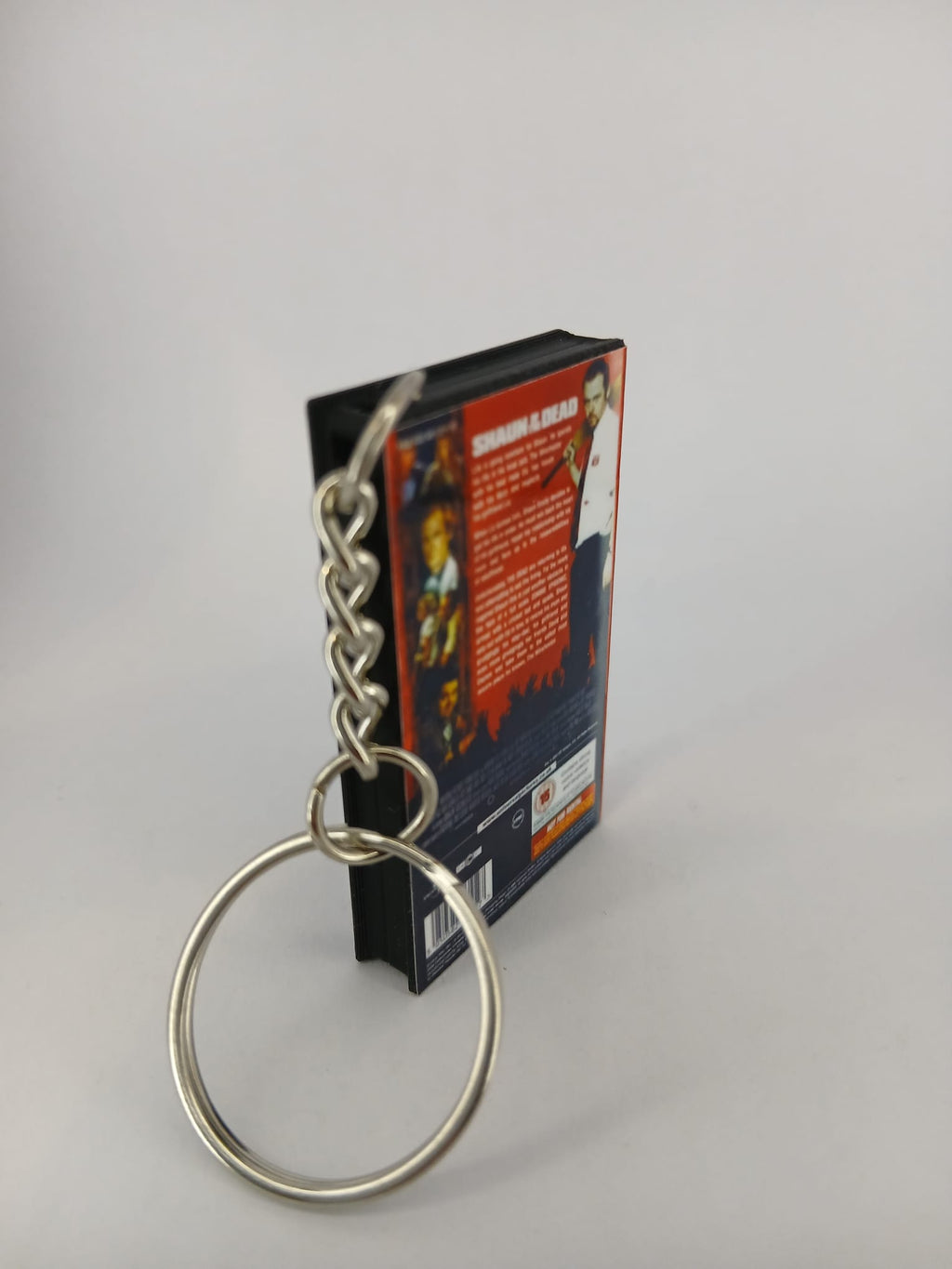 Shaun of the Dead VHS keyring — spine view standing