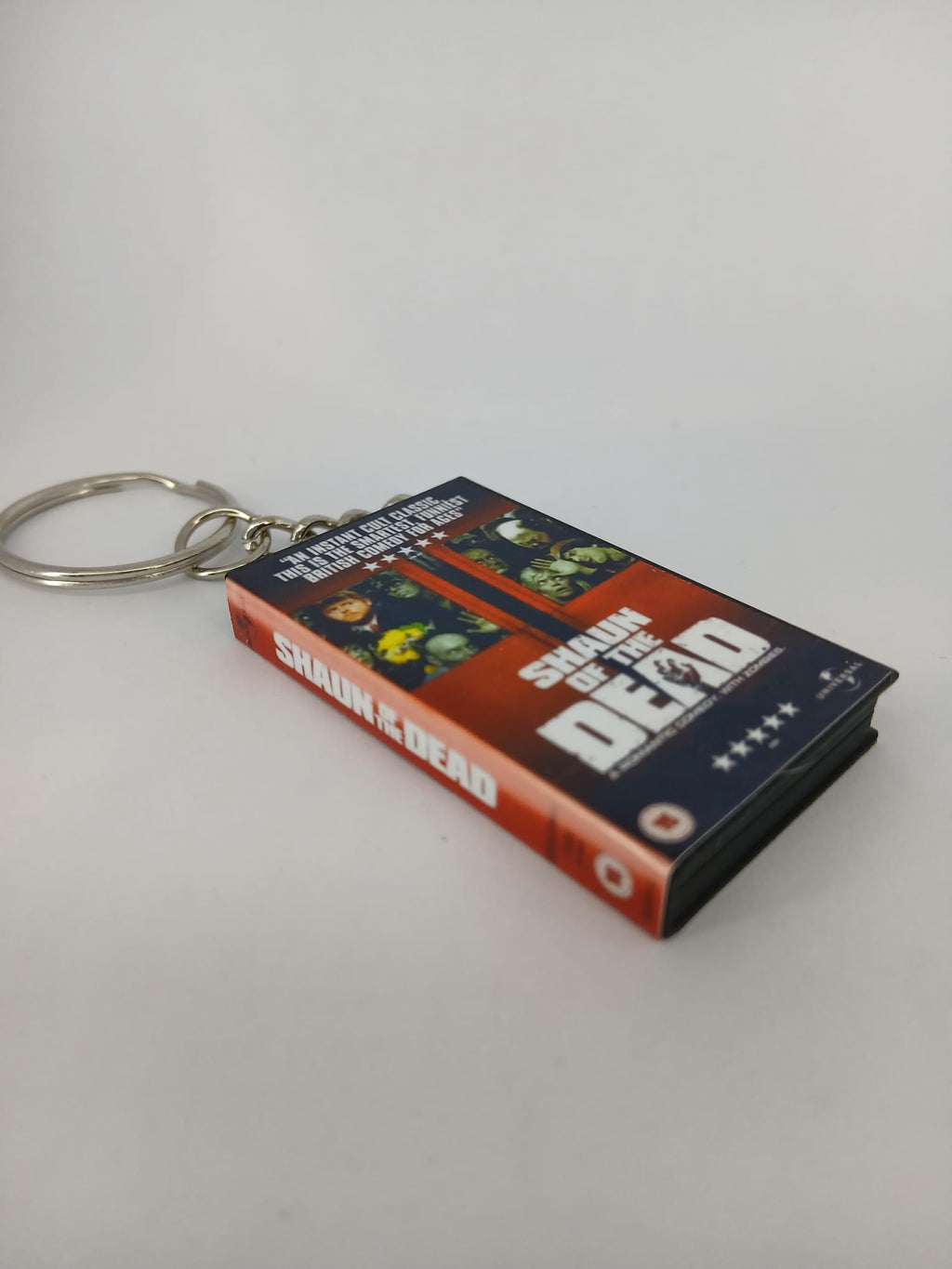 Shaun of the Dead VHS keyring — front cover standing angled 3