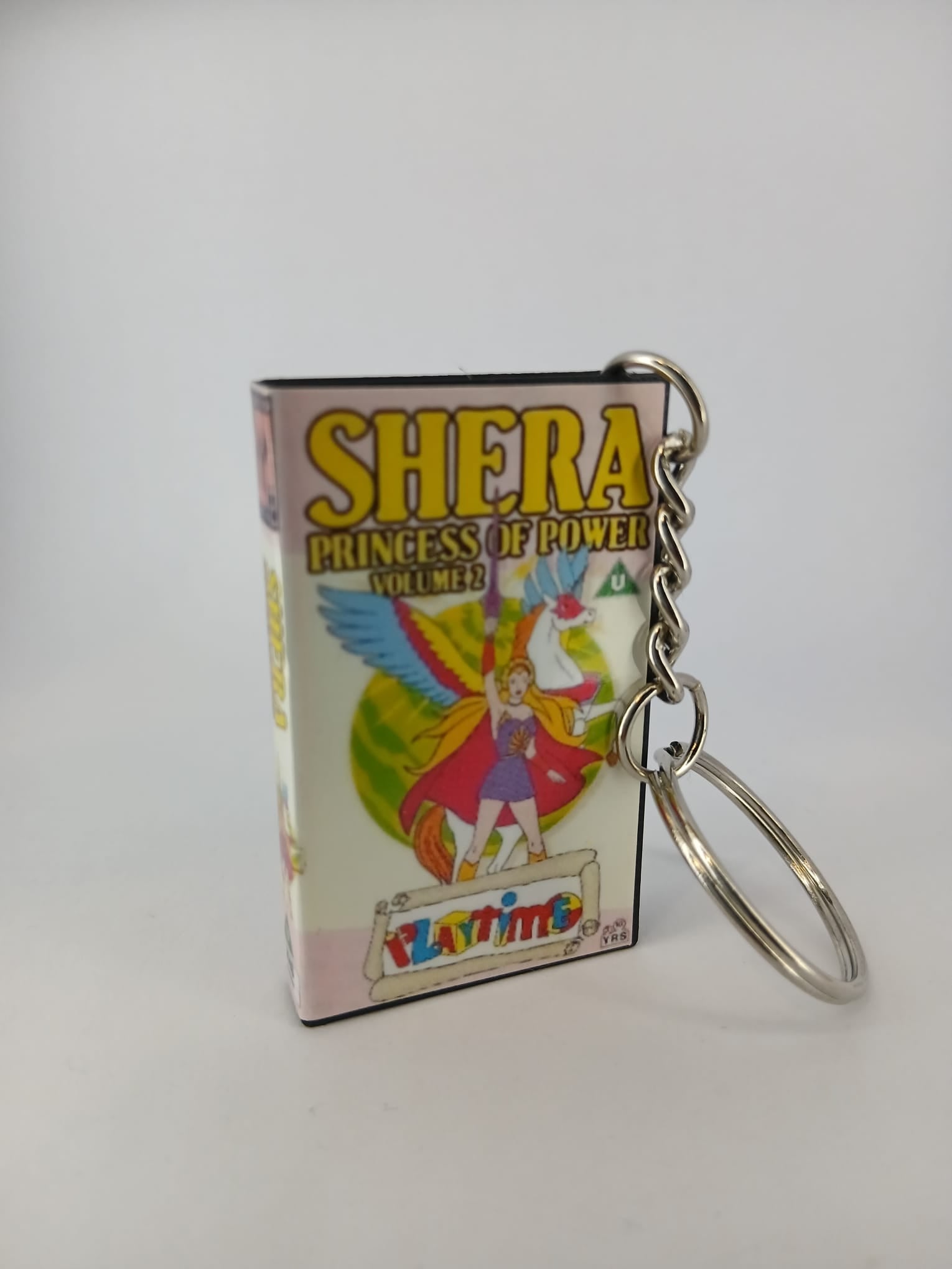 She-Ra Princess of Power VHS keyring — spine view standing