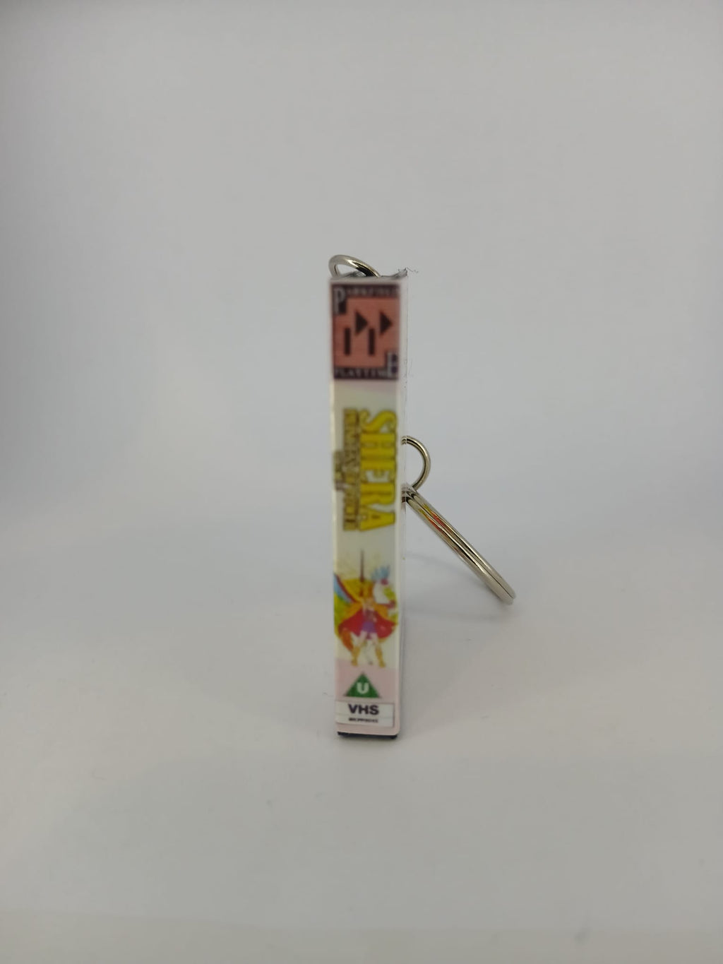 She-Ra Princess of Power VHS keyring — back cover standing angled 2