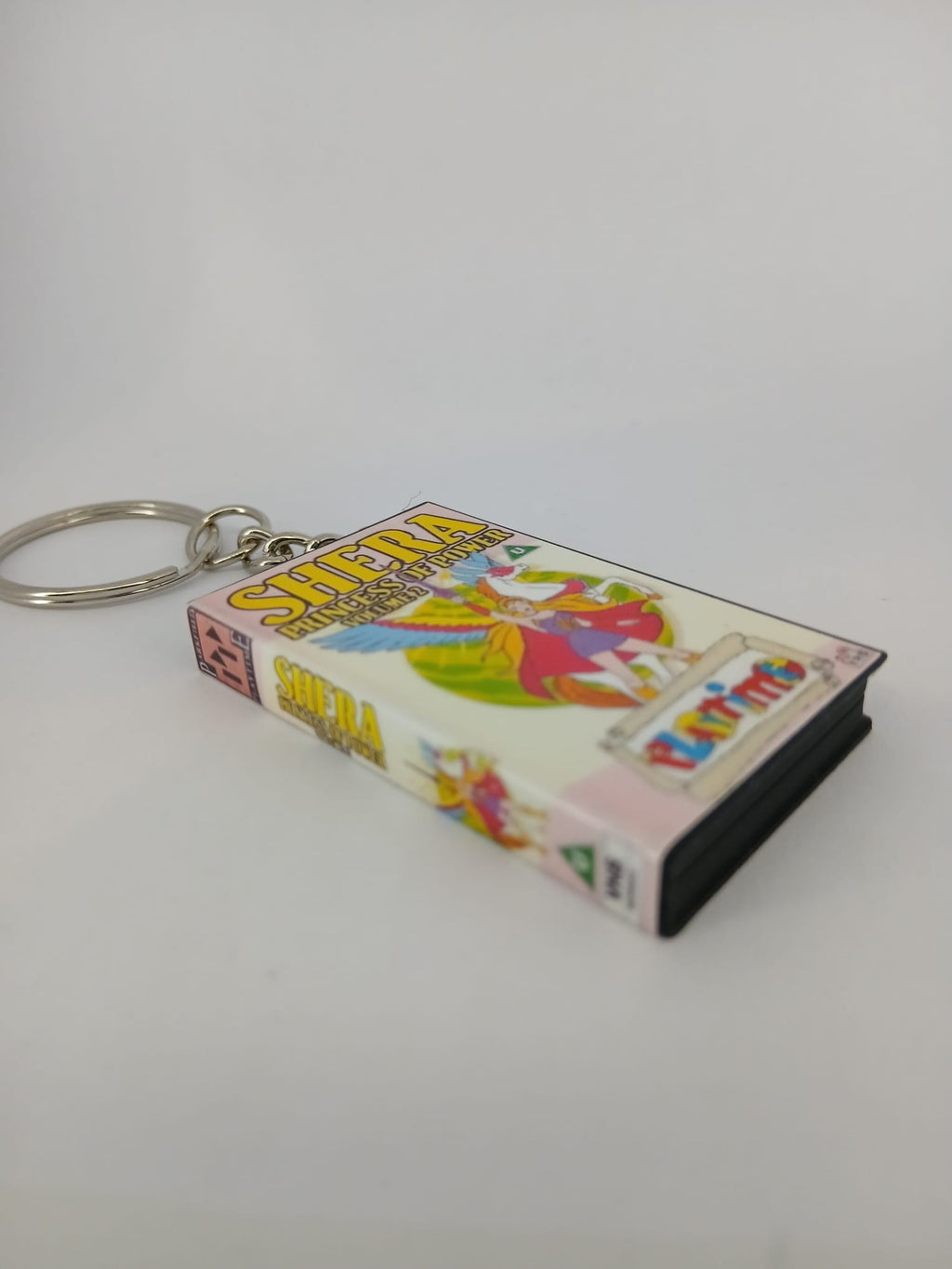 She-Ra Princess of Power VHS keyring — flat lay full wrap overview