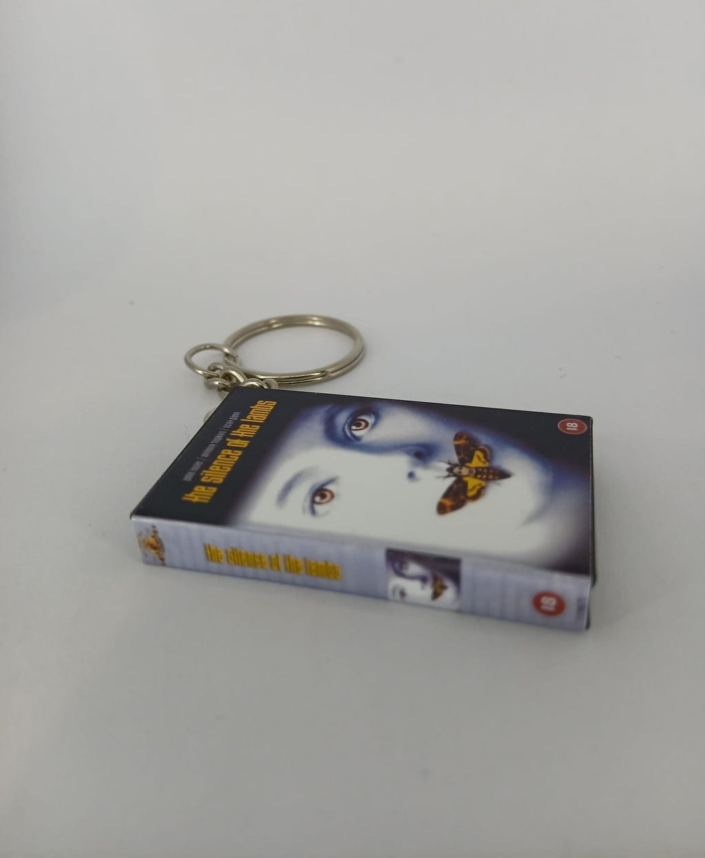 The Silence of the Lambs VHS keyring — spine view standing