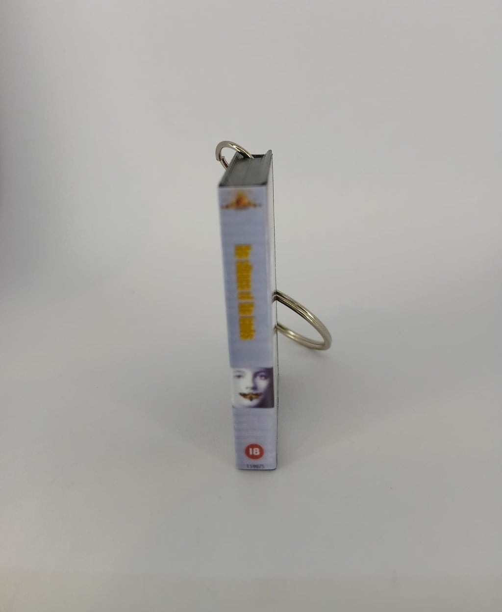 The Silence of the Lambs VHS keyring — front cover standing angled