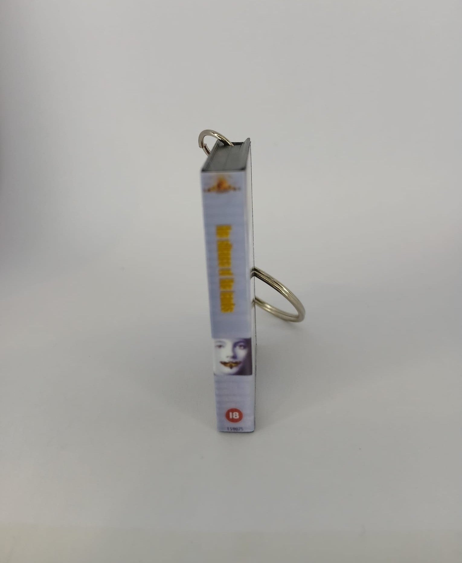 The Silence of the Lambs VHS keyring — front cover standing angled