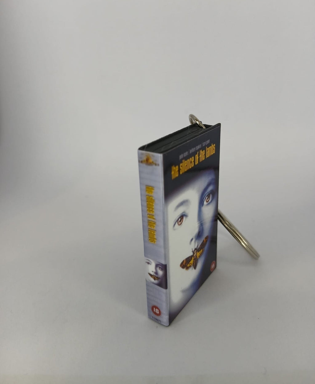 The Silence of the Lambs VHS keyring — back cover standing with full credits visible