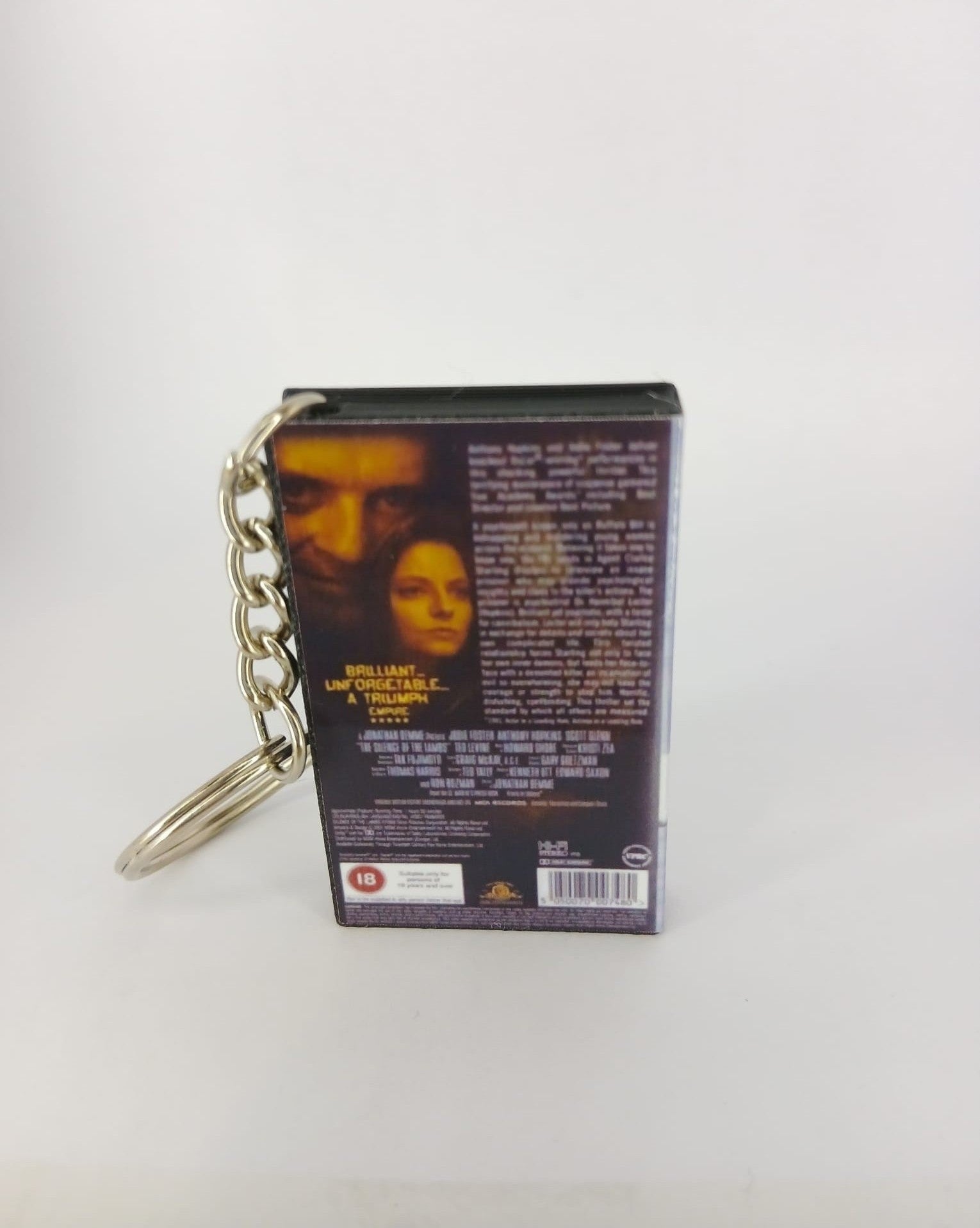 The Silence of the Lambs VHS keyring — front cover standing angled 3