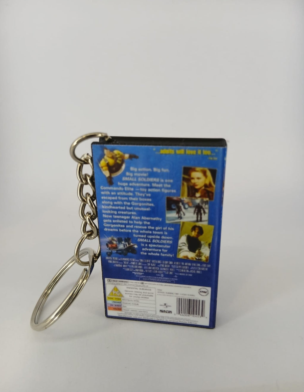Small Soldiers VHS keyring — front cover standing with coin for scale