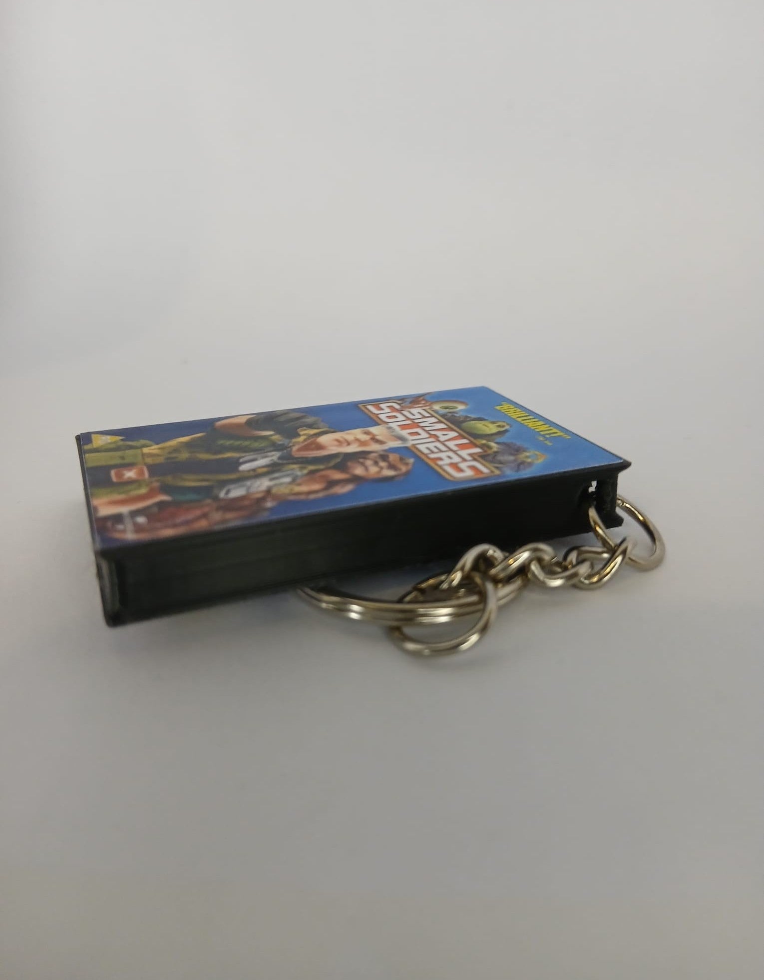 Small Soldiers VHS keyring — spine view standing