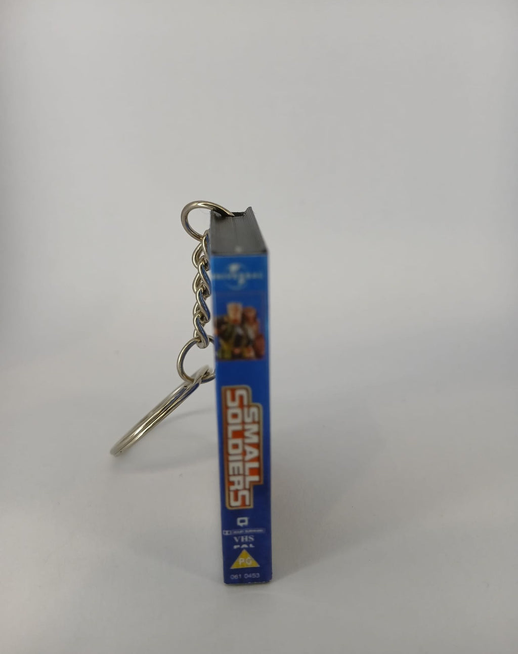 Small Soldiers VHS keyring — back and spine angled view standing