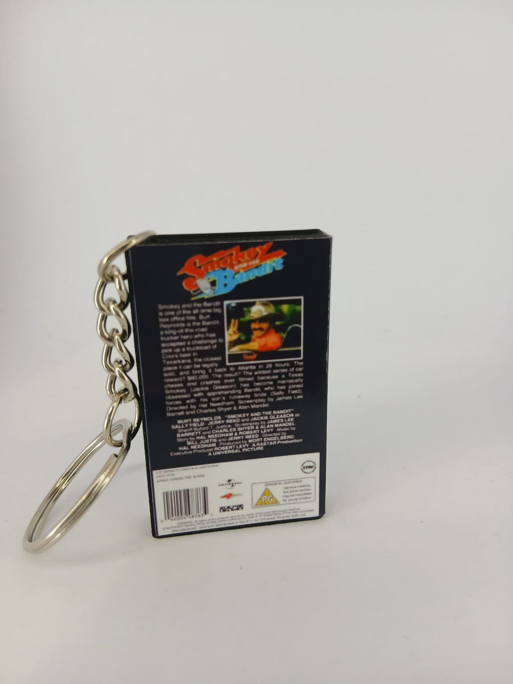 Smokey and the Bandit VHS keyring — flat lay front and spine angled
