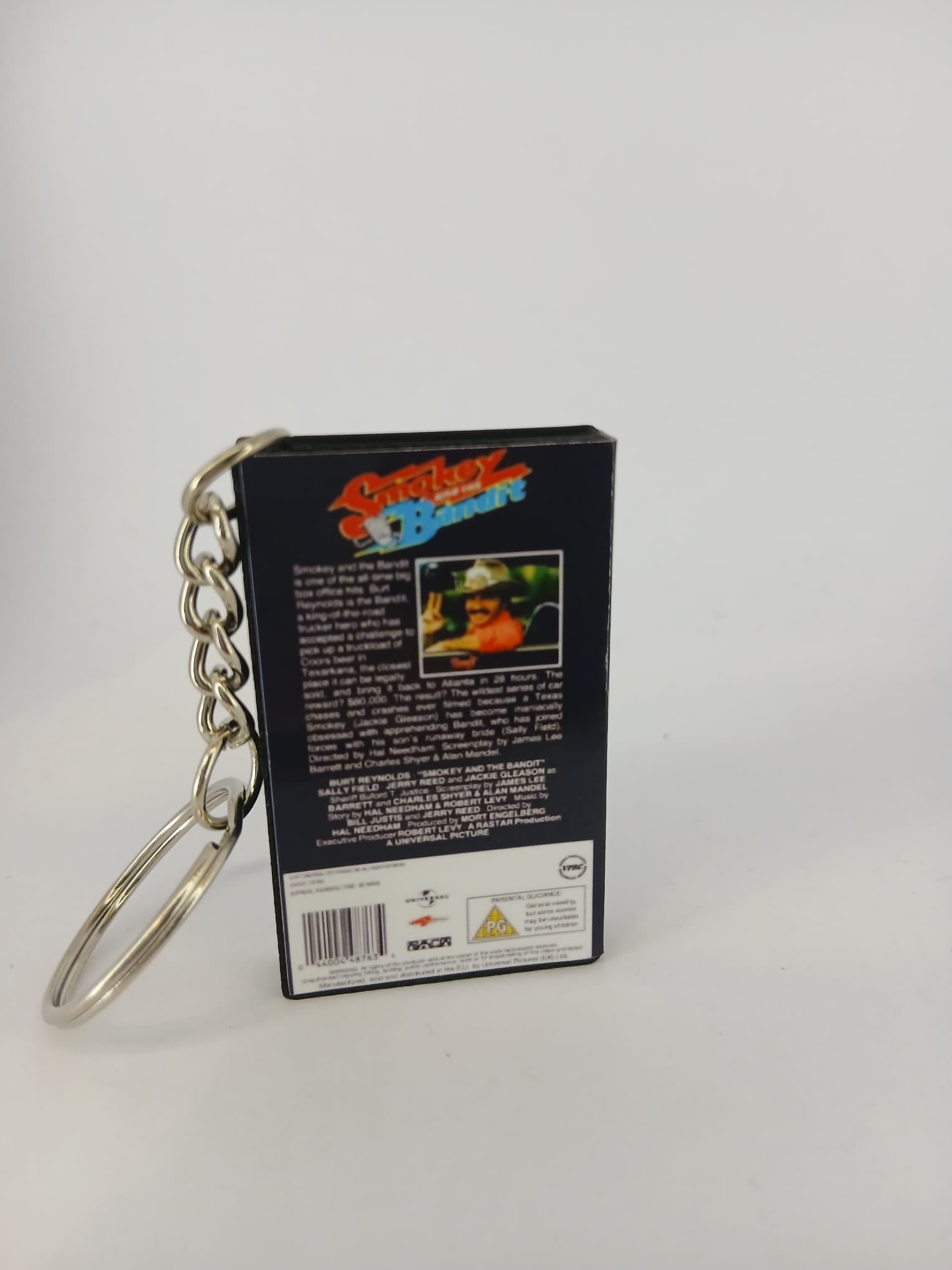 Smokey and the Bandit VHS keyring — flat lay front and spine angled