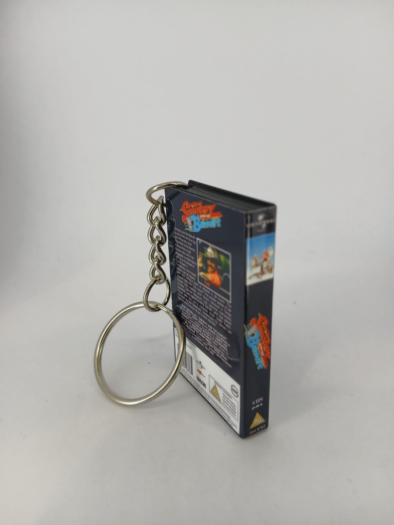 Smokey and the Bandit VHS keyring — spine and front angled view standing