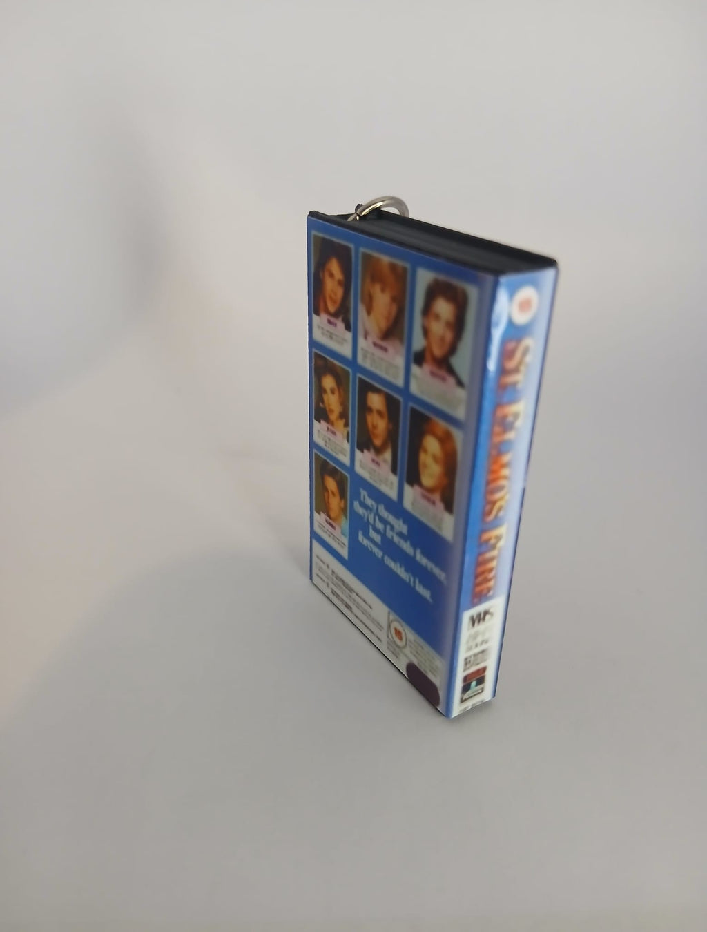 St. Elmo’s Fire Mini VHS Keyring – overhead flat lay