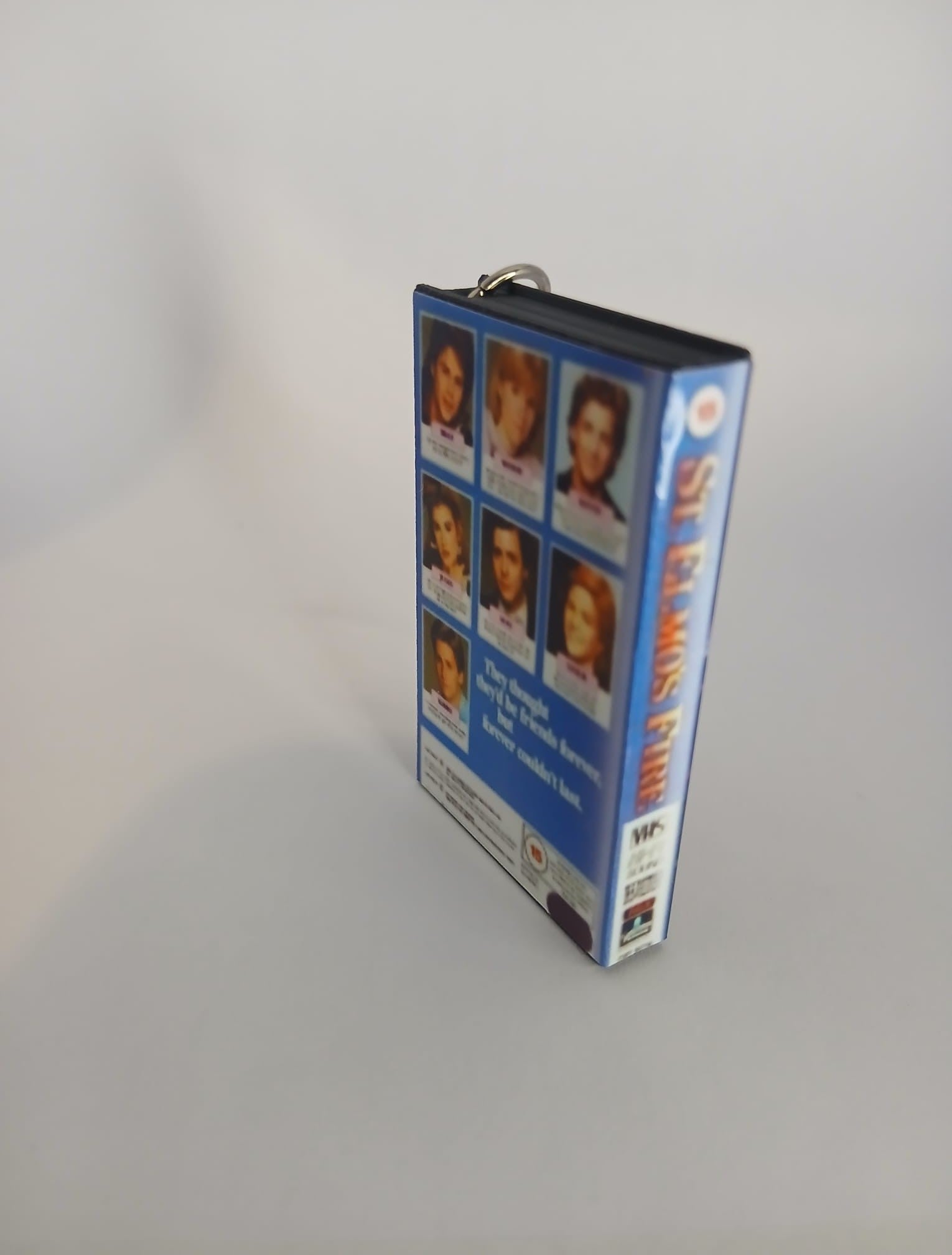St. Elmo’s Fire Mini VHS Keyring – overhead flat lay