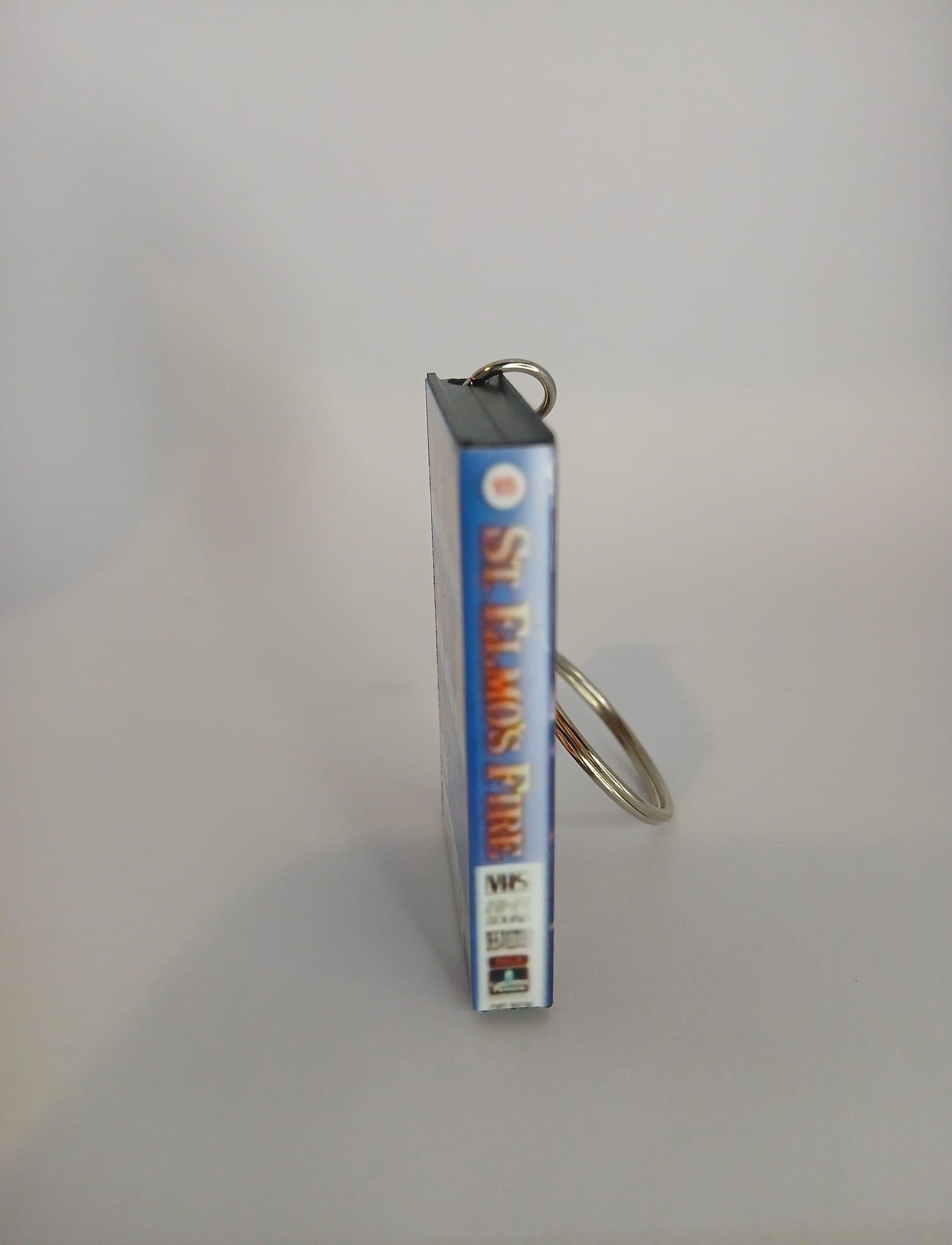St. Elmo’s Fire Mini VHS Keyring – back flat lay