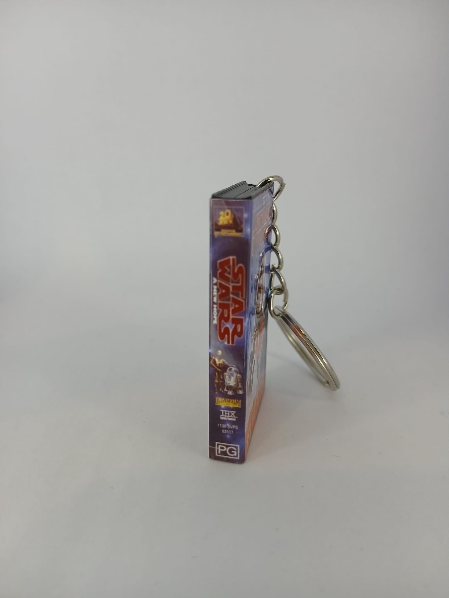 Star Wars A New Hope VHS keyring — front cover with 1p coin for scale