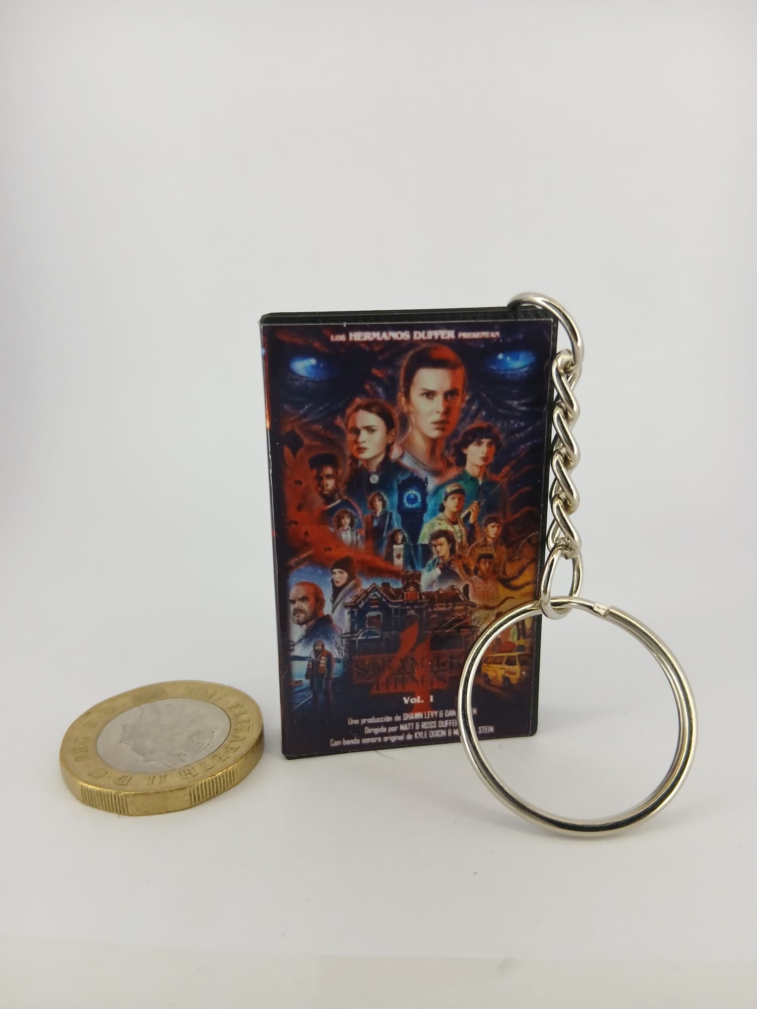 Stranger Things S4 Vol.1 VHS keyring — back cover angled view standing