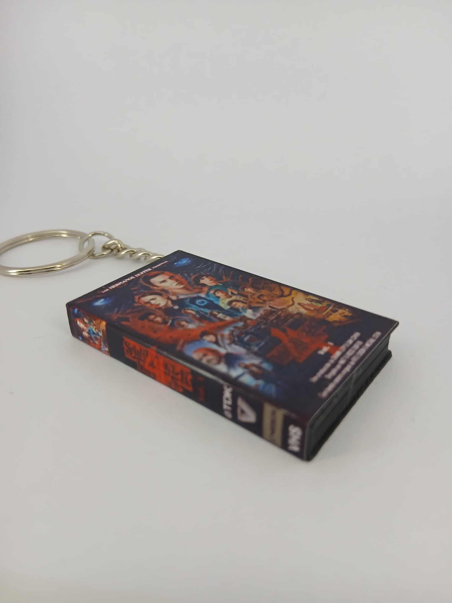 Stranger Things S4 Vol.1 VHS keyring — back cover standing angled 2