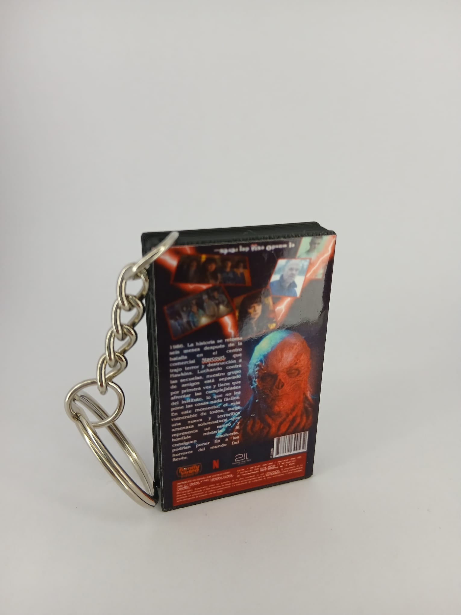 Stranger Things S4 Vol.1 VHS keyring — spine view standing