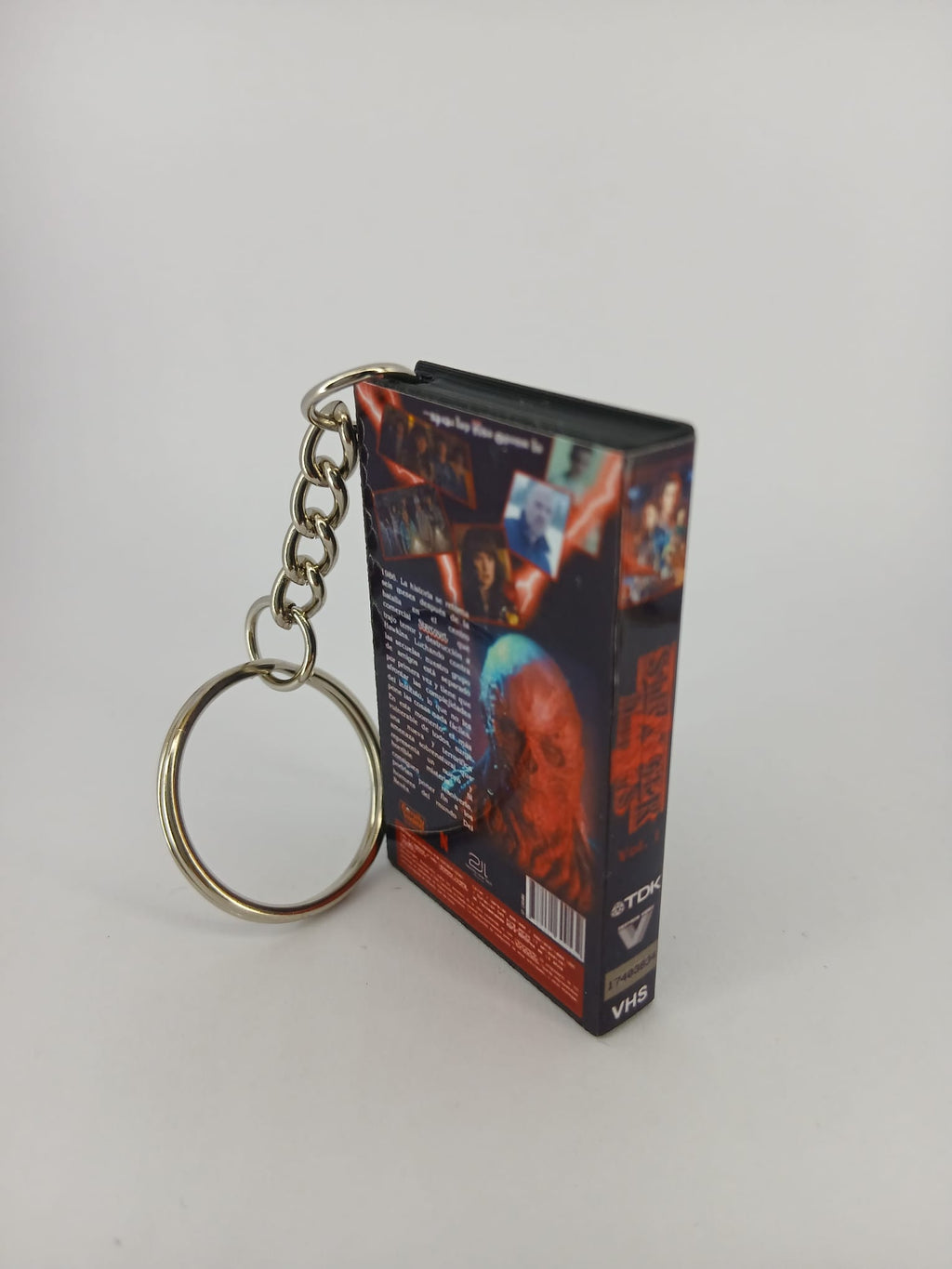 Stranger Things S4 Vol.1 VHS keyring — front and spine angled view standing