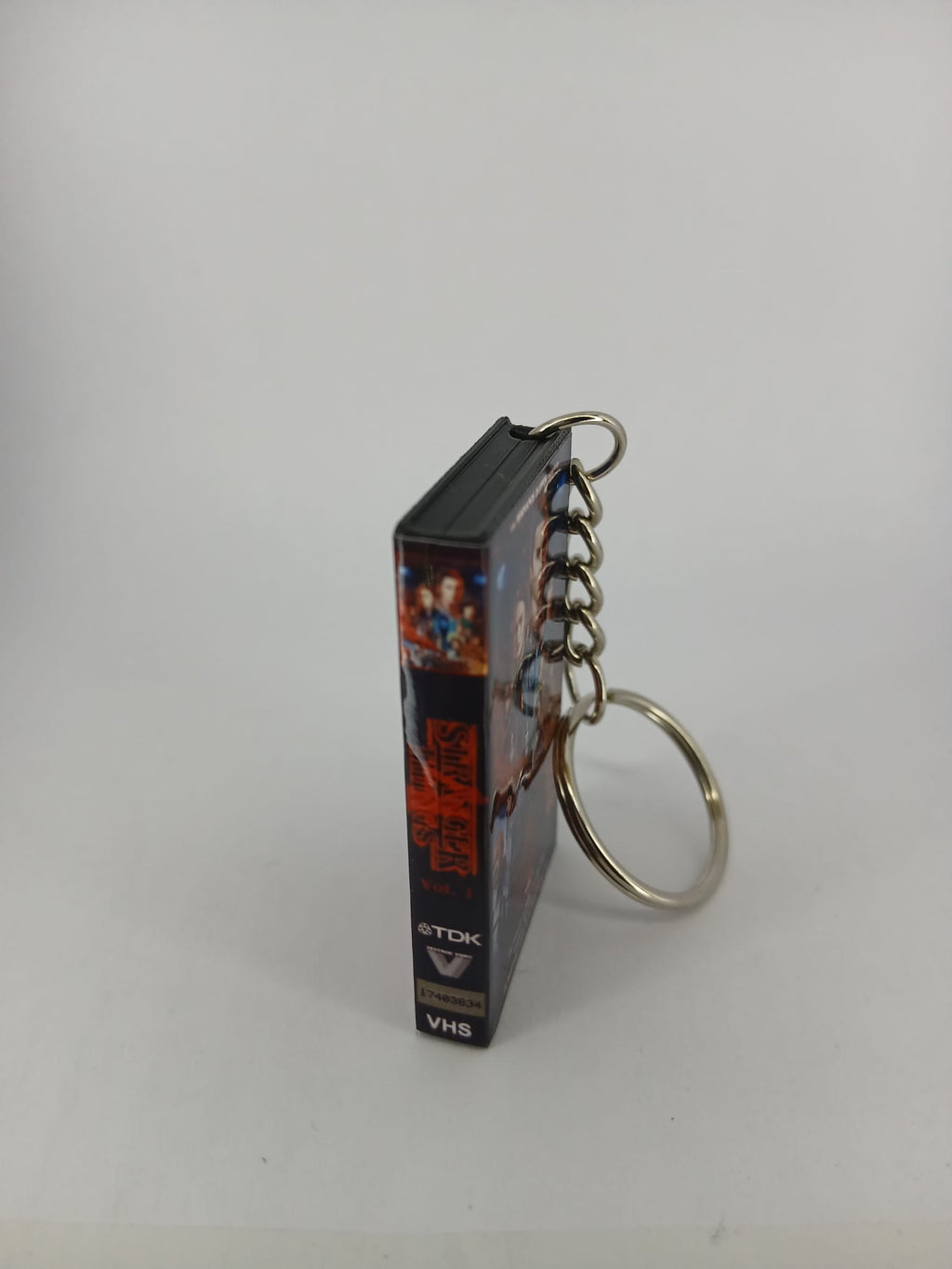 Stranger Things S4 Vol.1 VHS keyring — front cover standing angled
