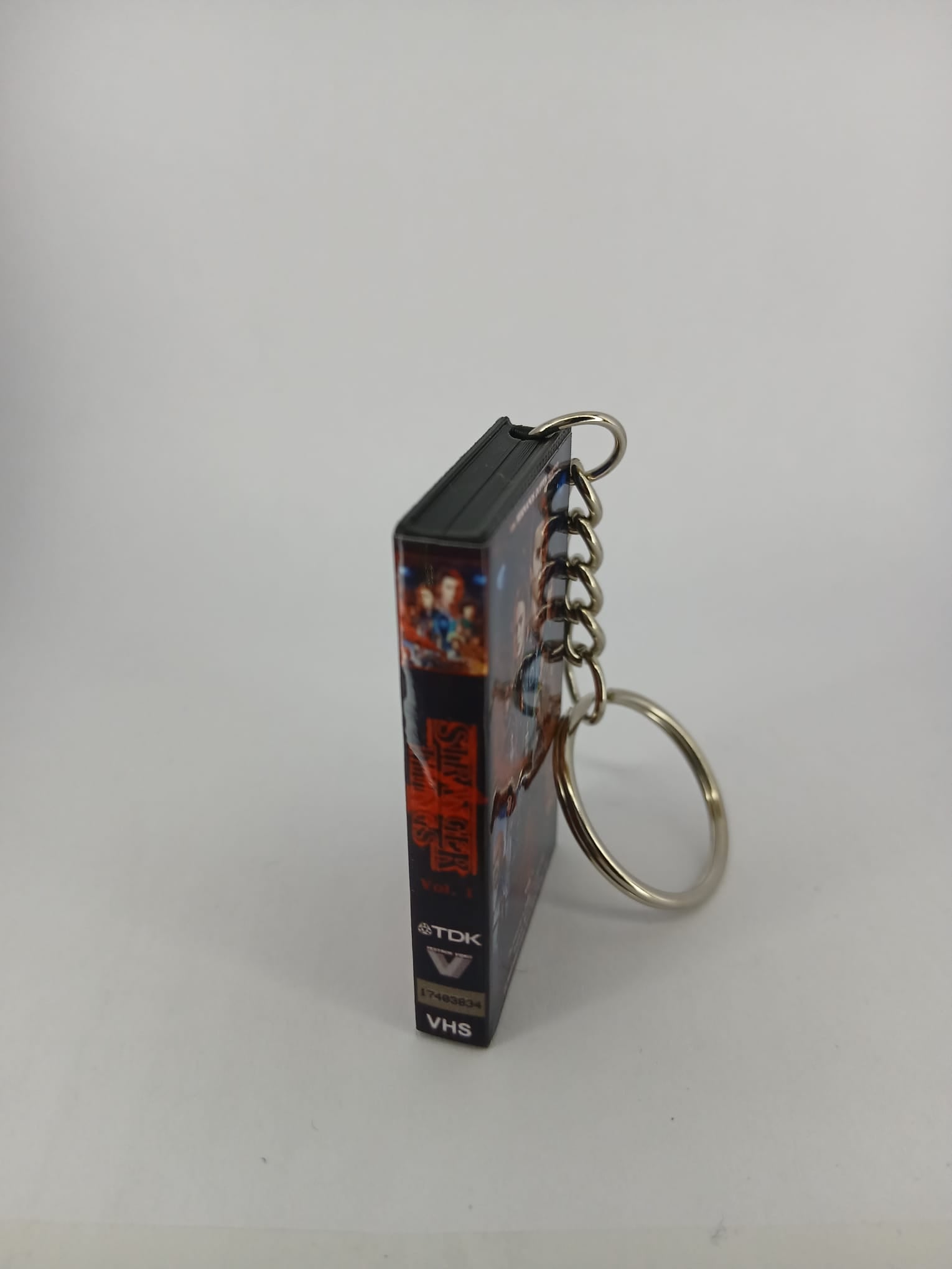 Stranger Things S4 Vol.1 VHS keyring — front cover standing angled