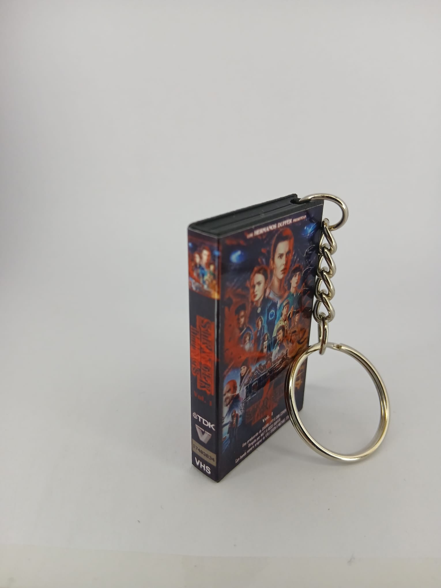 Stranger Things S4 Vol.1 VHS keyring — front cover standing angled 2