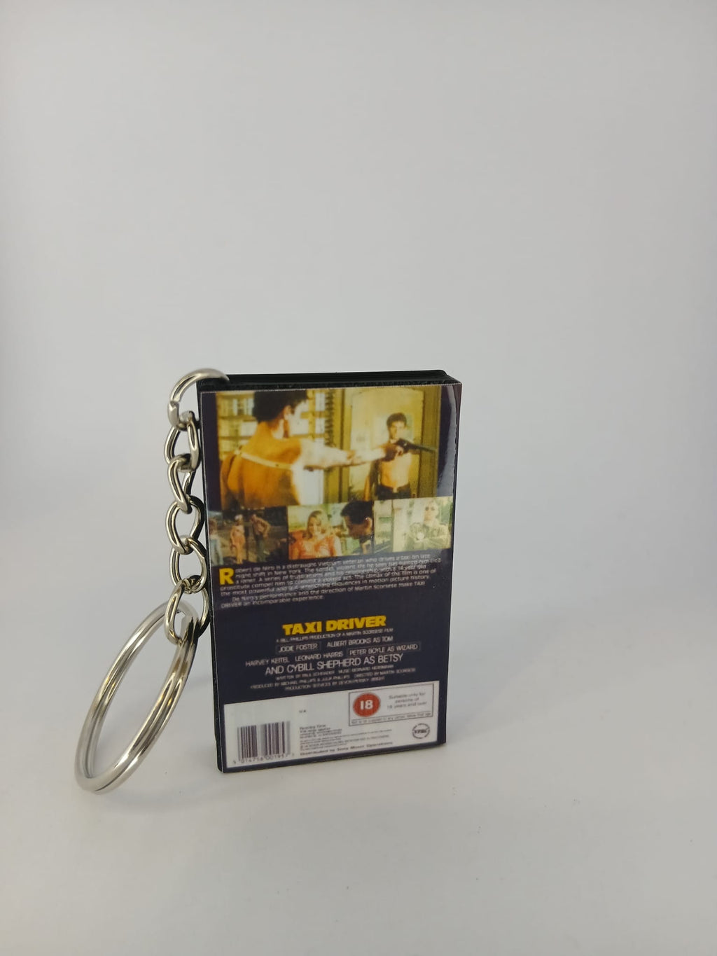 Taxi Driver VHS keyring — front and spine flat lay angled