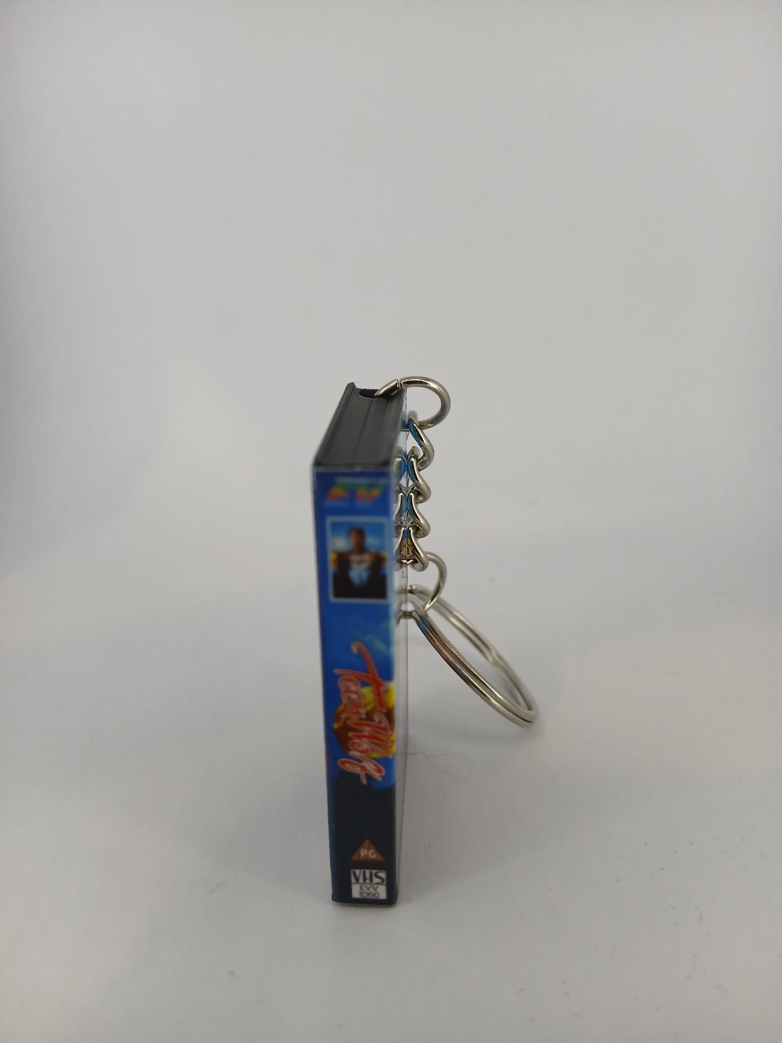 Teen Wolf VHS keyring — back cover angled view standing